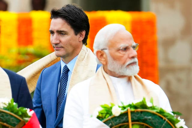 <p>Canada's Prime Minister Justin Trudeau, left, walks past India's Prime Minister Narendra Modi in 2023 </p>