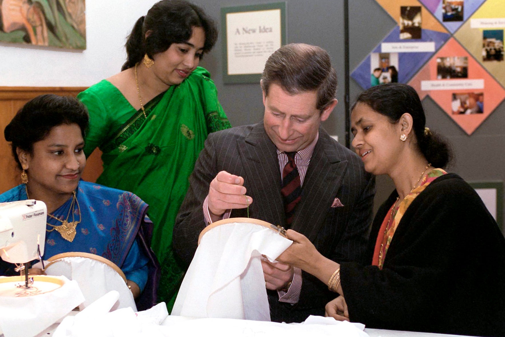 King Charles wants to encourage people to live more sustainable lives. He is pictured her learning embroidery in London.