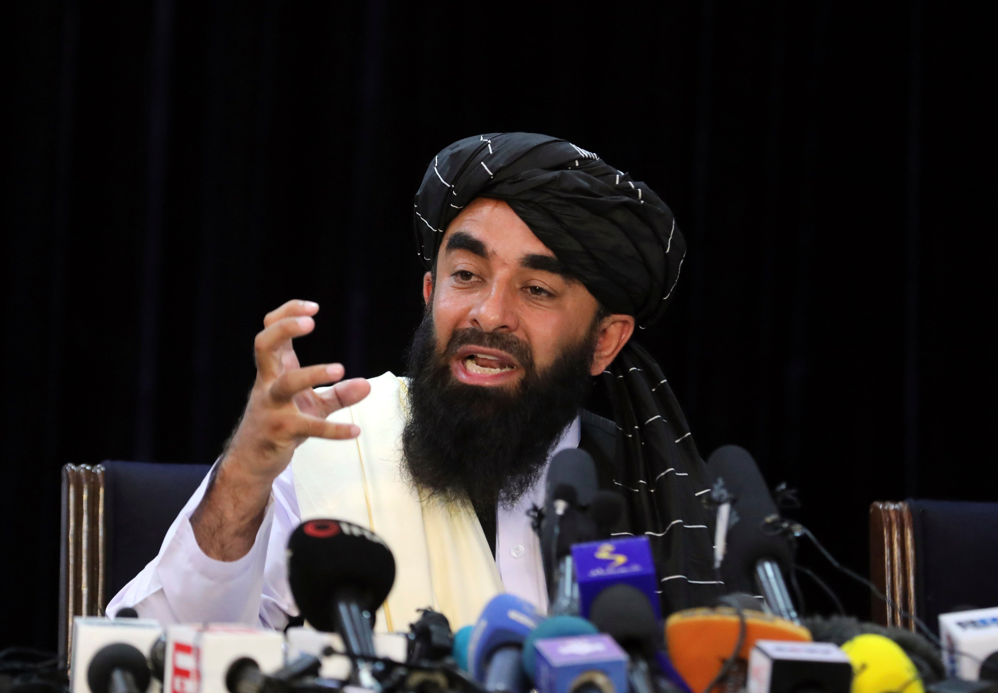 Taliban spokesman Zabihullah Mujahid speaks at his first news conference, in Kabul, Afghanistan, Tuesday, Aug. 17, 2021