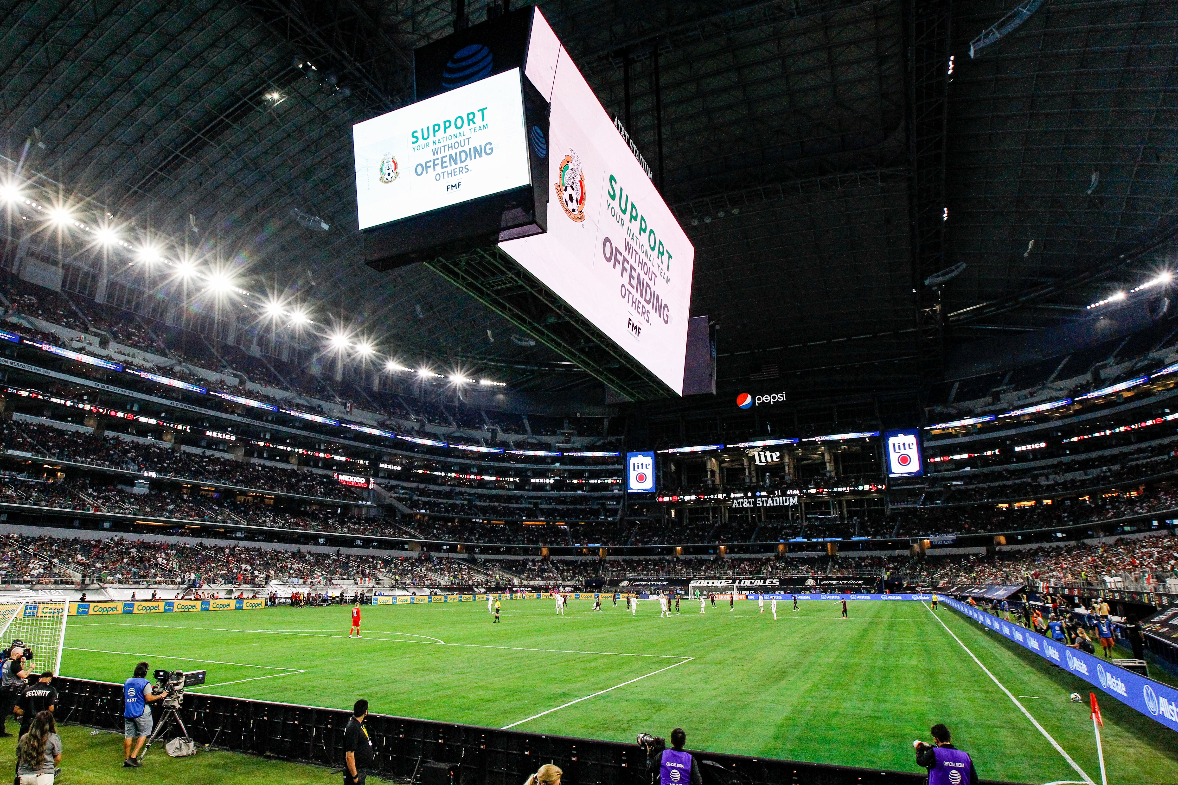 A message on the video board warns fans to not chant a homophobic slur during an international friendly match between Mexico and Iceland, May 29, 2021