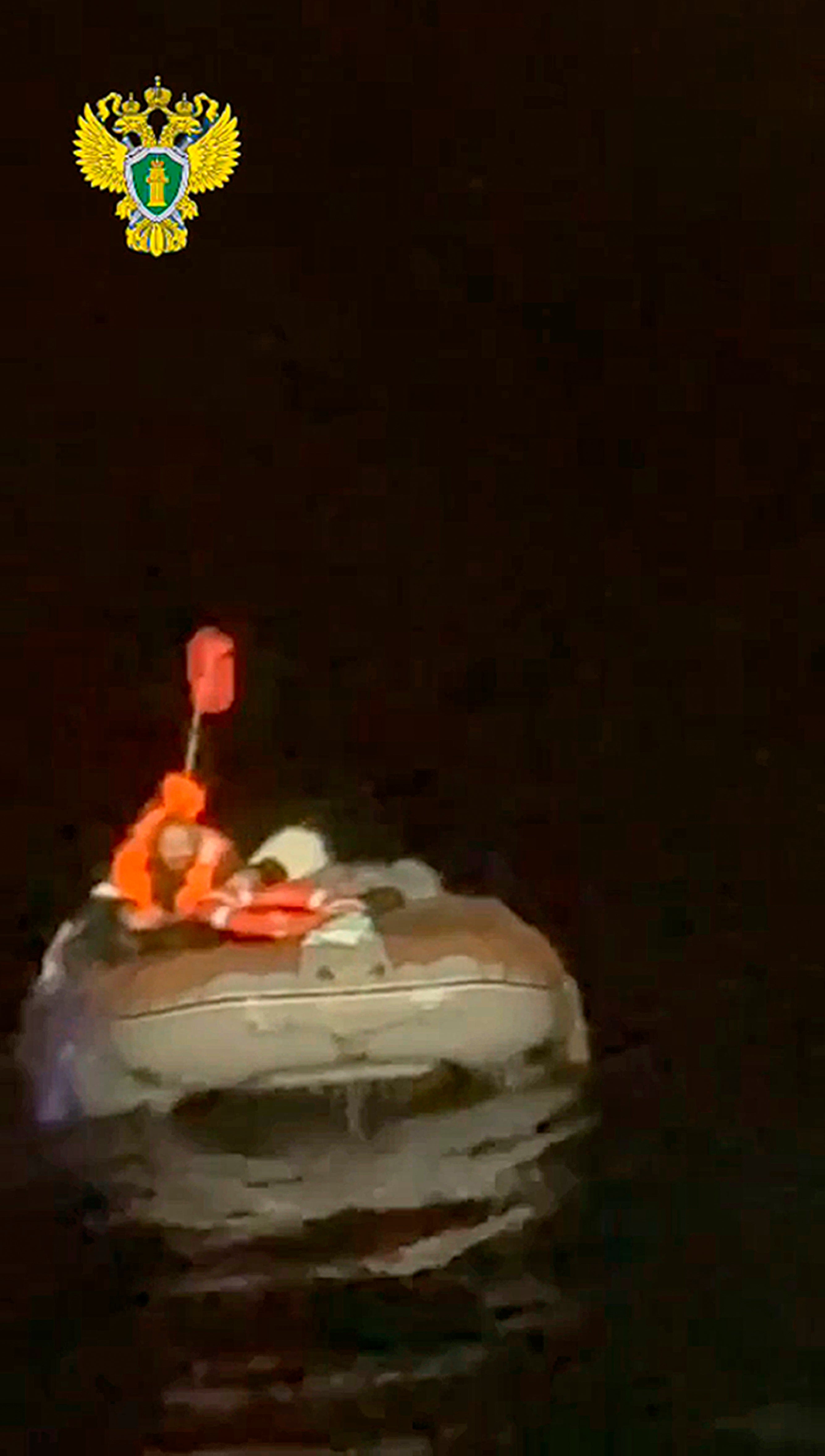 In this photo taken from video released by the official telegram channel of the Russian Far Eastern Transport Prosecutor's Office on Tuesday, Oct. 15, 2024, a Russian man who spent more than two months adrift in an inflatable boat is seen before being rescued by a fishing vessel in the Okhotsk Sea near the village of Ust-Khairuzovo in Kamchatka region of Russian far east