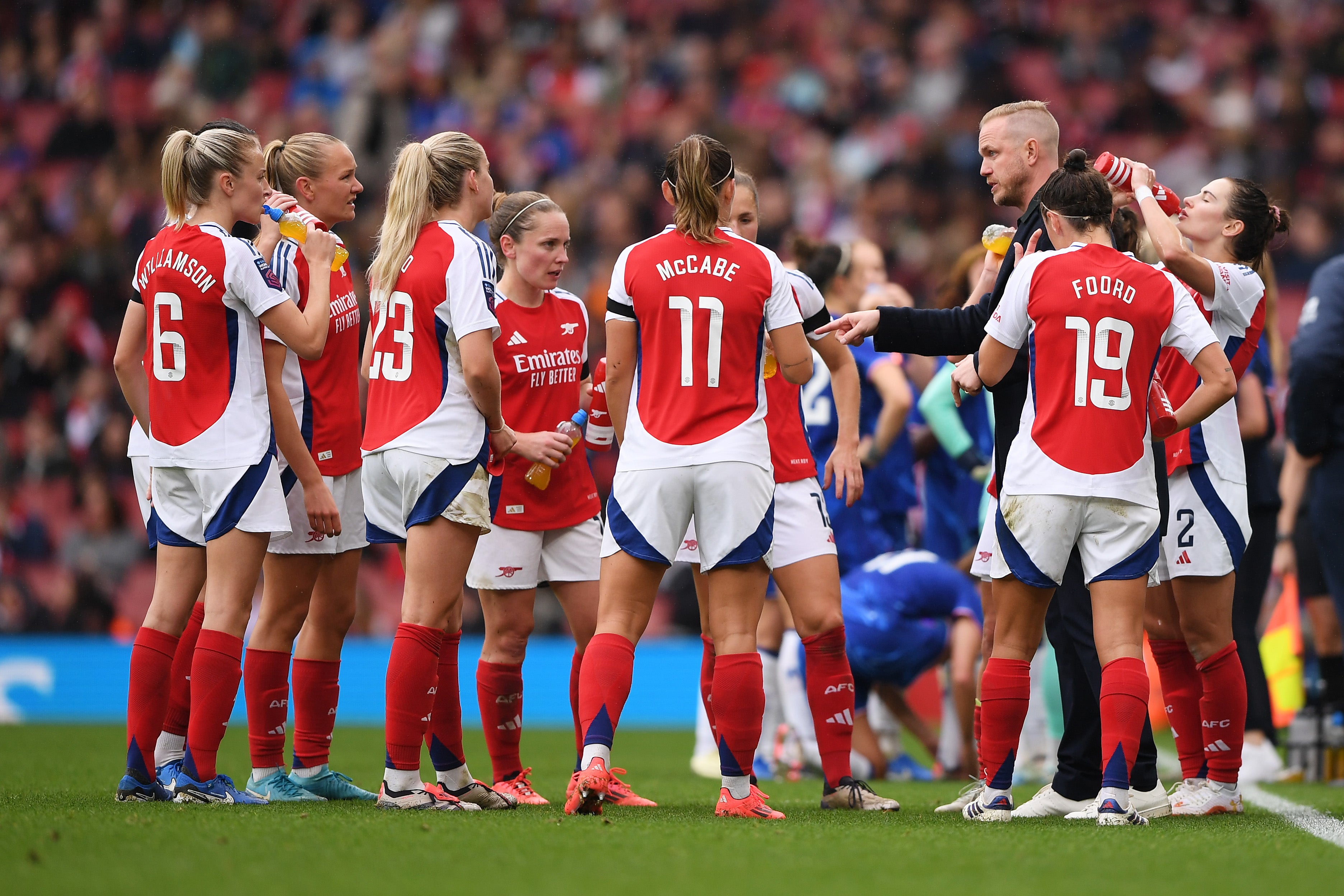 Eidevall talks with his team during the Women’s Super League match against Chelsea