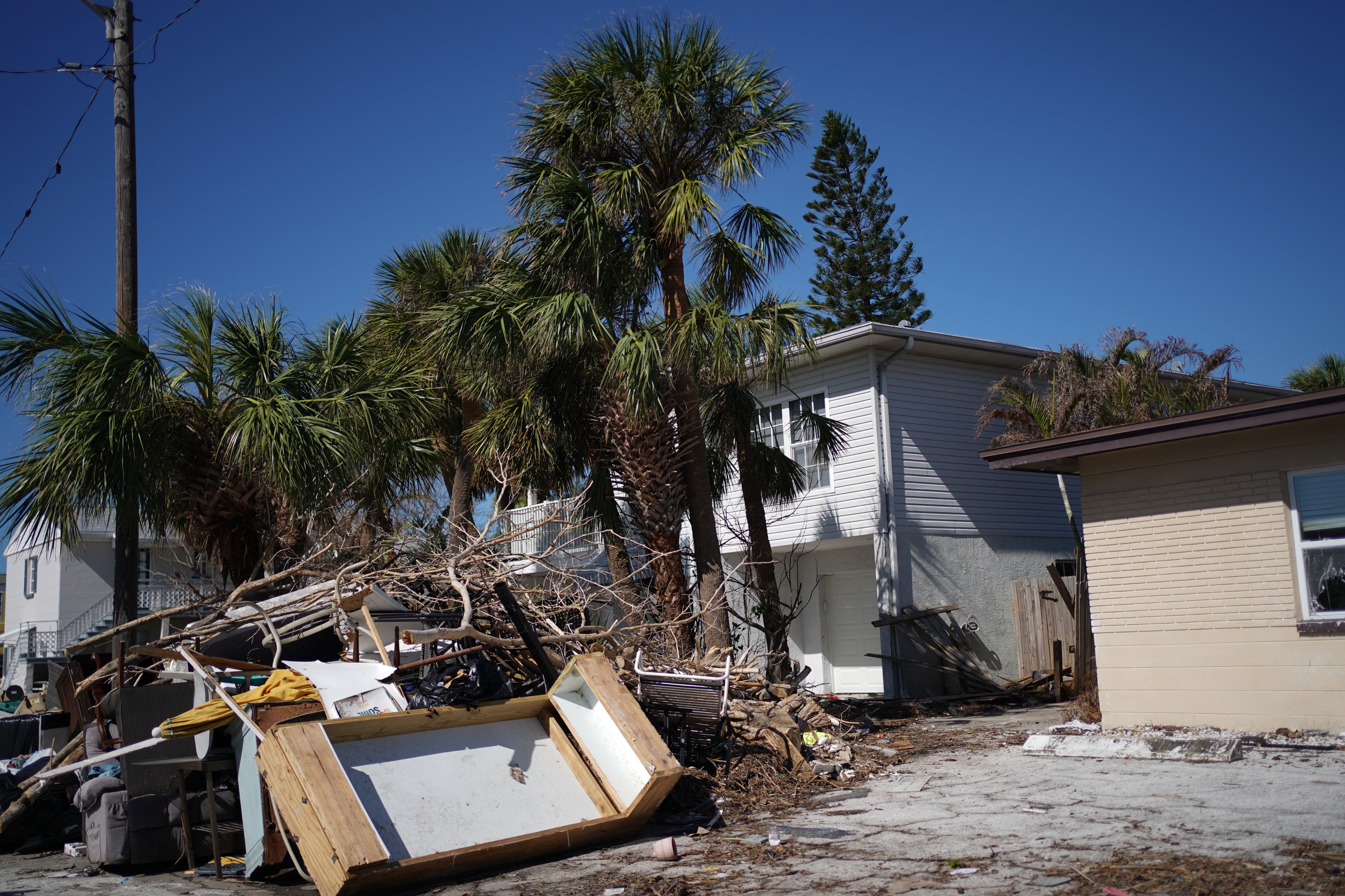 Debris and damage from Hurricane Milton as US President Joe Biden visits the area, in St. Pete Beach, Florida, on October 13, 2024. Hurricanes have created more hurdles for patients to seek bortion access in the southeastern US, a region already plagued with barriers to abortion care