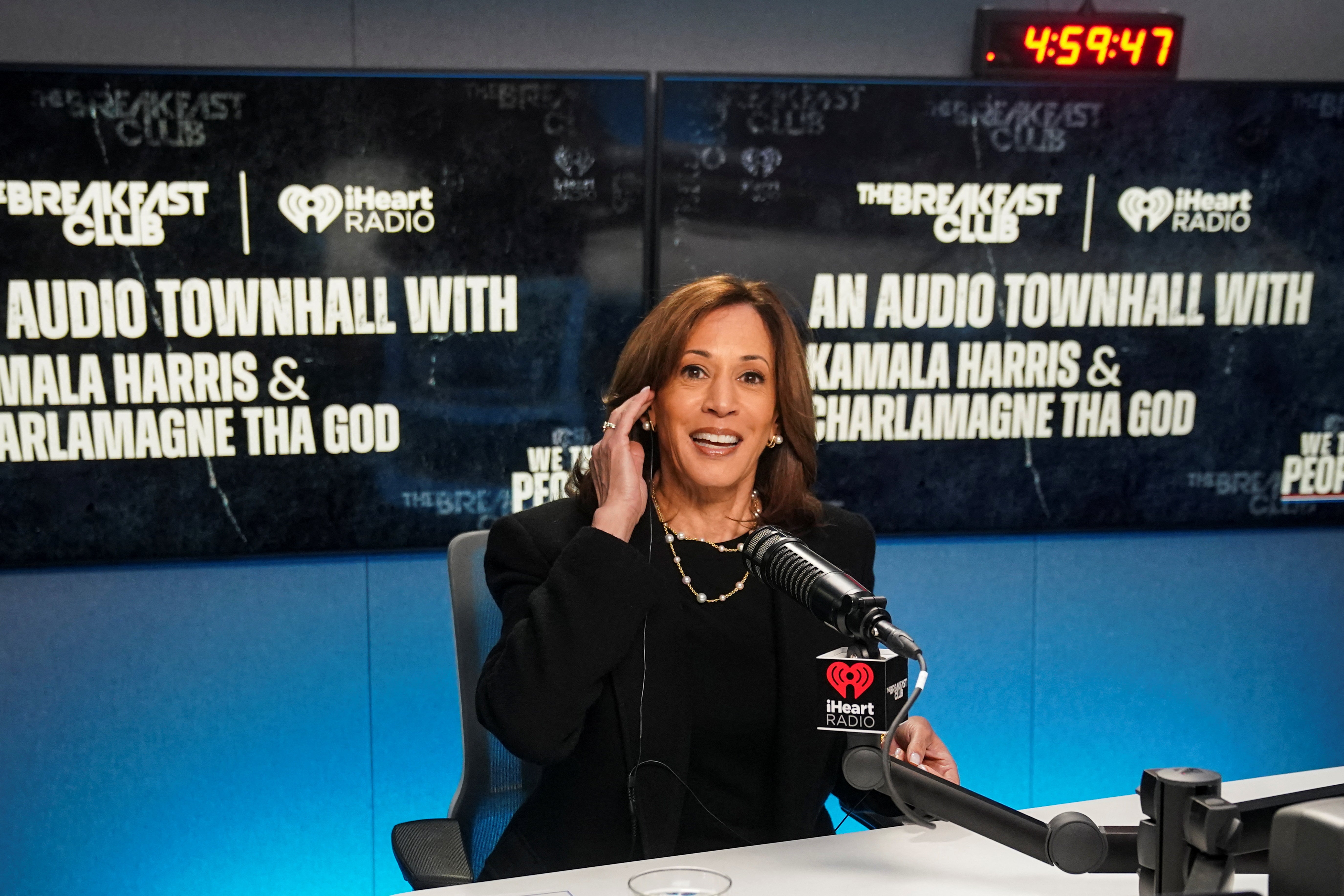 Democratic presidential candidate US Vice President Kamala Harris looks on as she takes part "City hall" with radio host Charlamagne Tha God in Detroit, Michigan