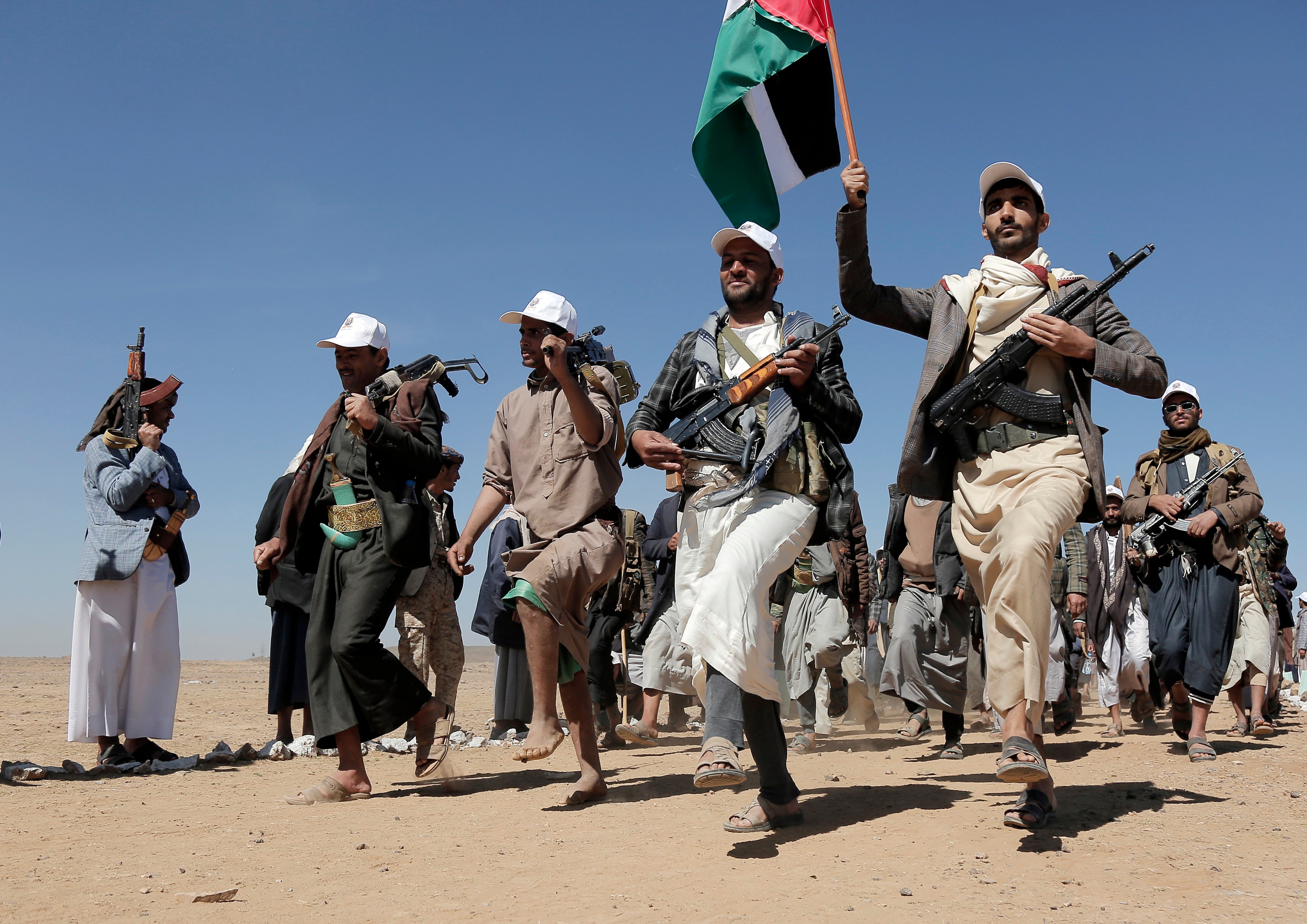 Houthi rebel fighters march during a rally of support for the Palestinians in the Gaza Stri