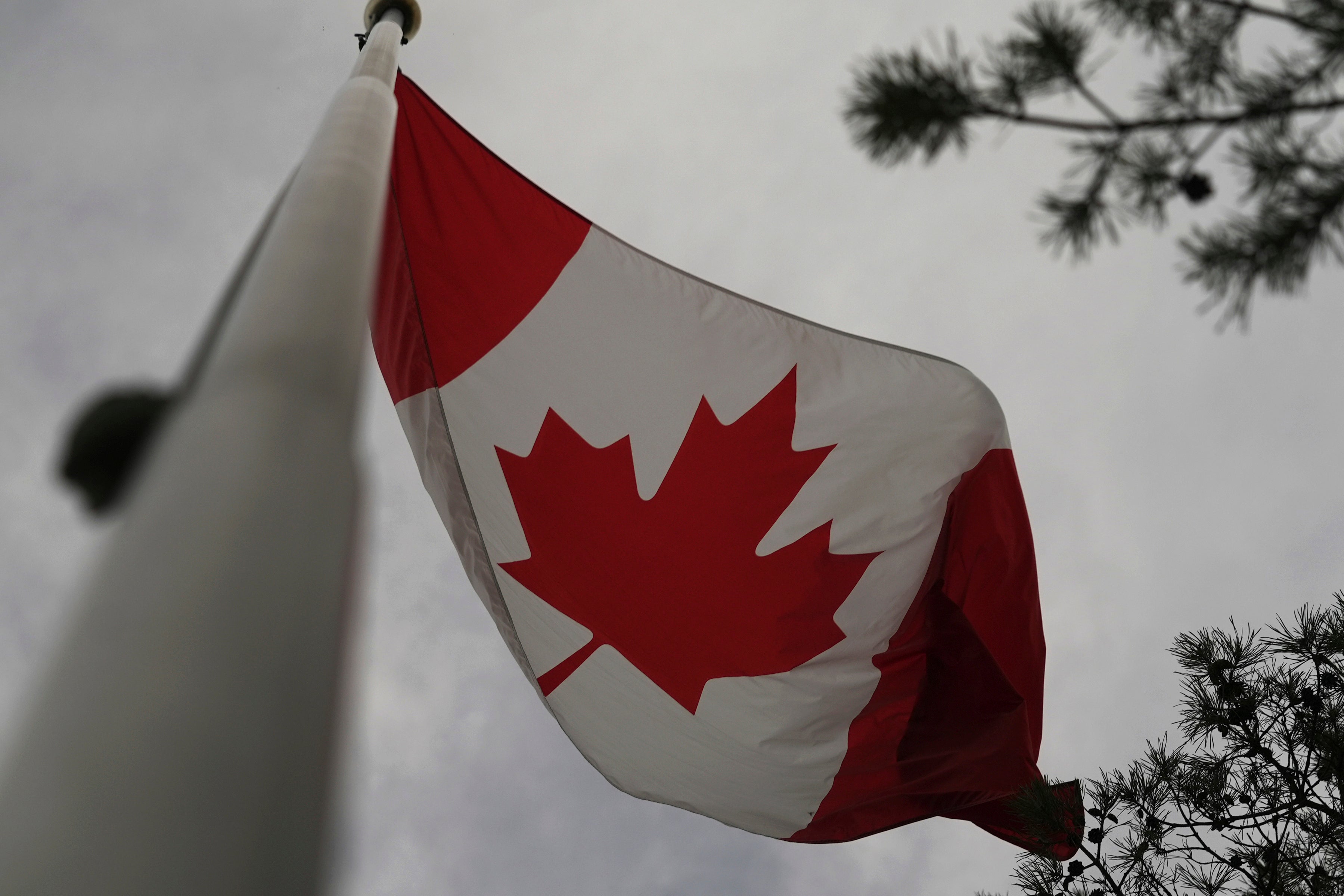 The Canadian flag is blown by wind on Centre Island in Toronto on Thursday, Sept. 19, 2024