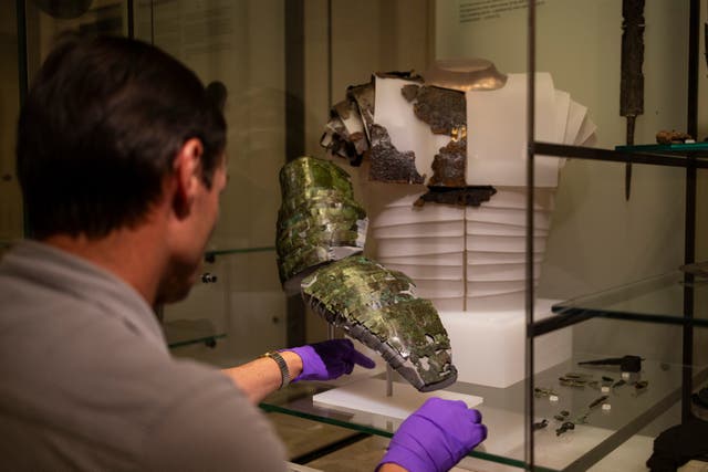 A ‘rare and special’ Roman arm guard unearthed near Melrose in 1906 has gone on display in its entirety in Scotland for the first time (Duncan McGlynn/PA)