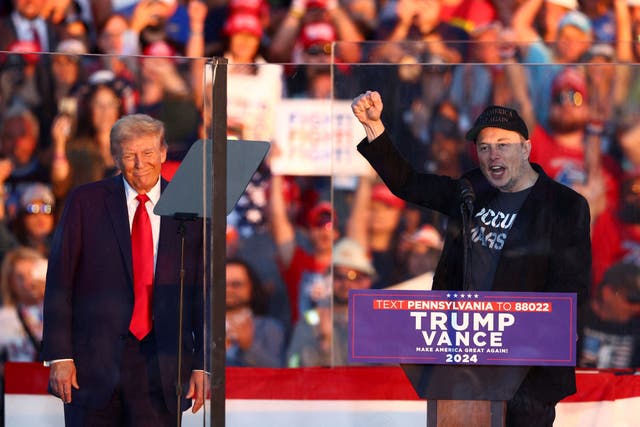 <p>Tesla CEO and X owner Elon Musk speaks as Republican presidential nominee and former U.S. president Donald Trump looks on during a rally at the site of the July assassination attempt against Trump, in Butler, Pennsylvania on October 5, 2024. Elon Musk, and two other billionaires Miriam Adelson and Dick Uihlein have donated a collective $220 million to the former president’s re-election campaign in the past three months </p>