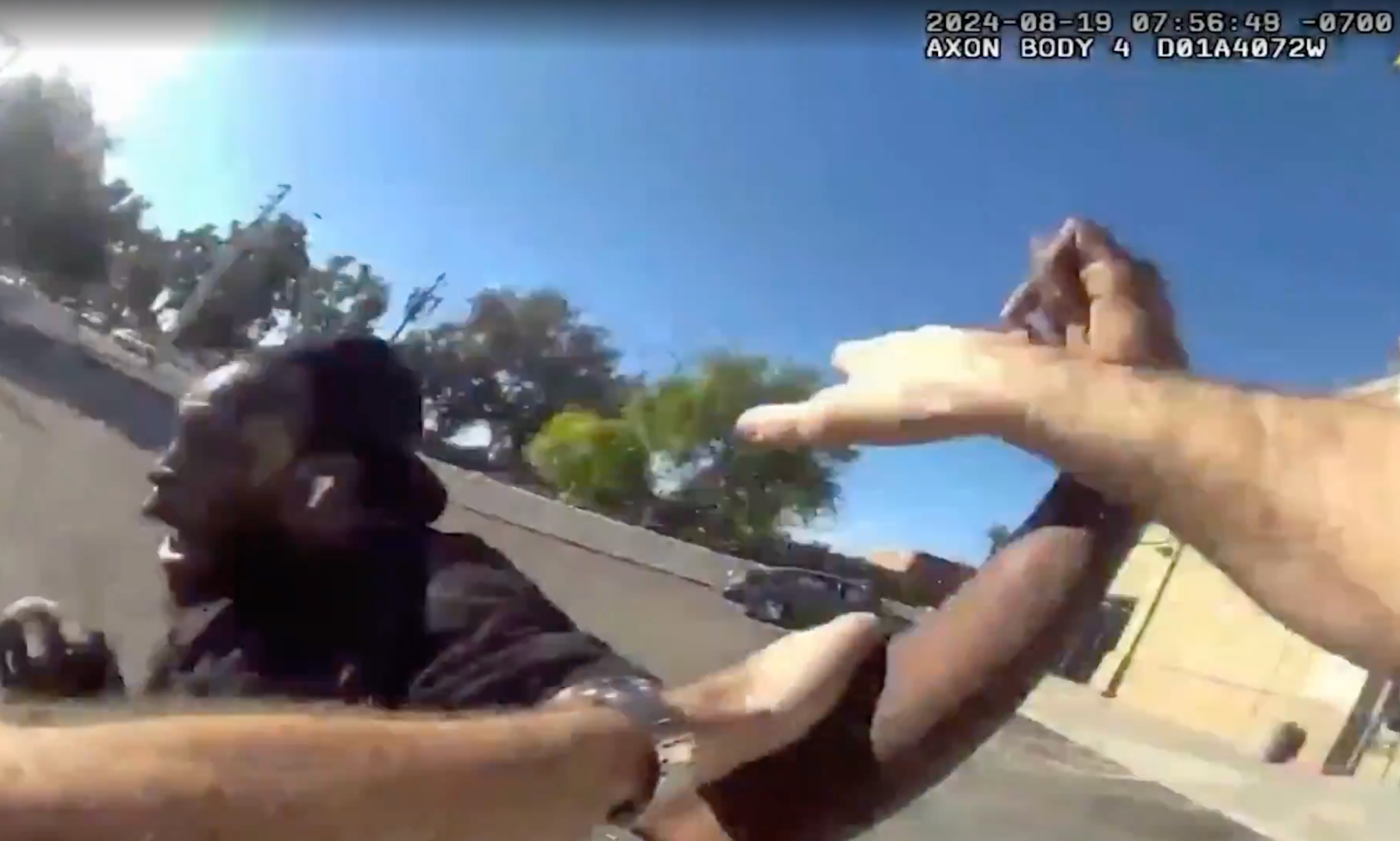 A police officer is seen grabbing Tyron McAlpin just seconds after he told the deaf man to stop