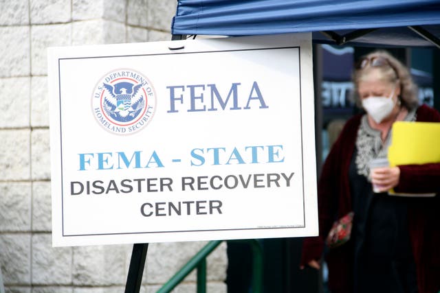 <p>People gather at a FEMA Disaster Recovery Center at A.C. Reynolds High School in Asheville, N.C., as part of the response effort to devastating 2024 floods</p>