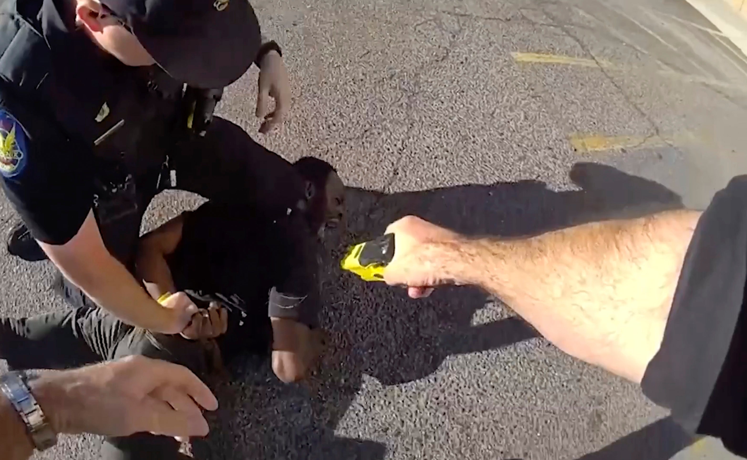 Body camera footage shows McAlpin being punched and shocked with a Taser by Phoenix police officers