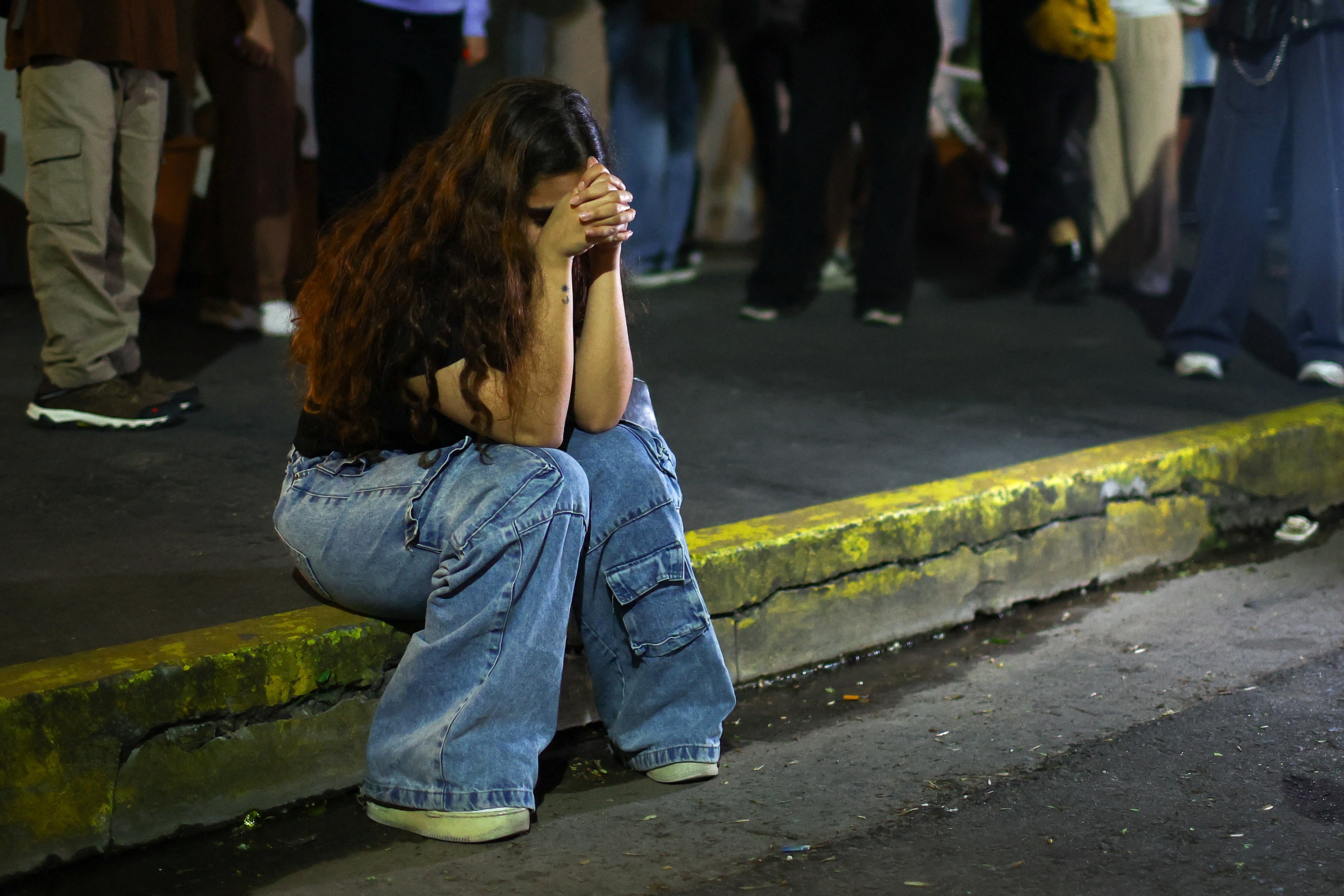 A fan reacts outside the hotel where Payne died. The 31-year-old found fame as a member of One Direction