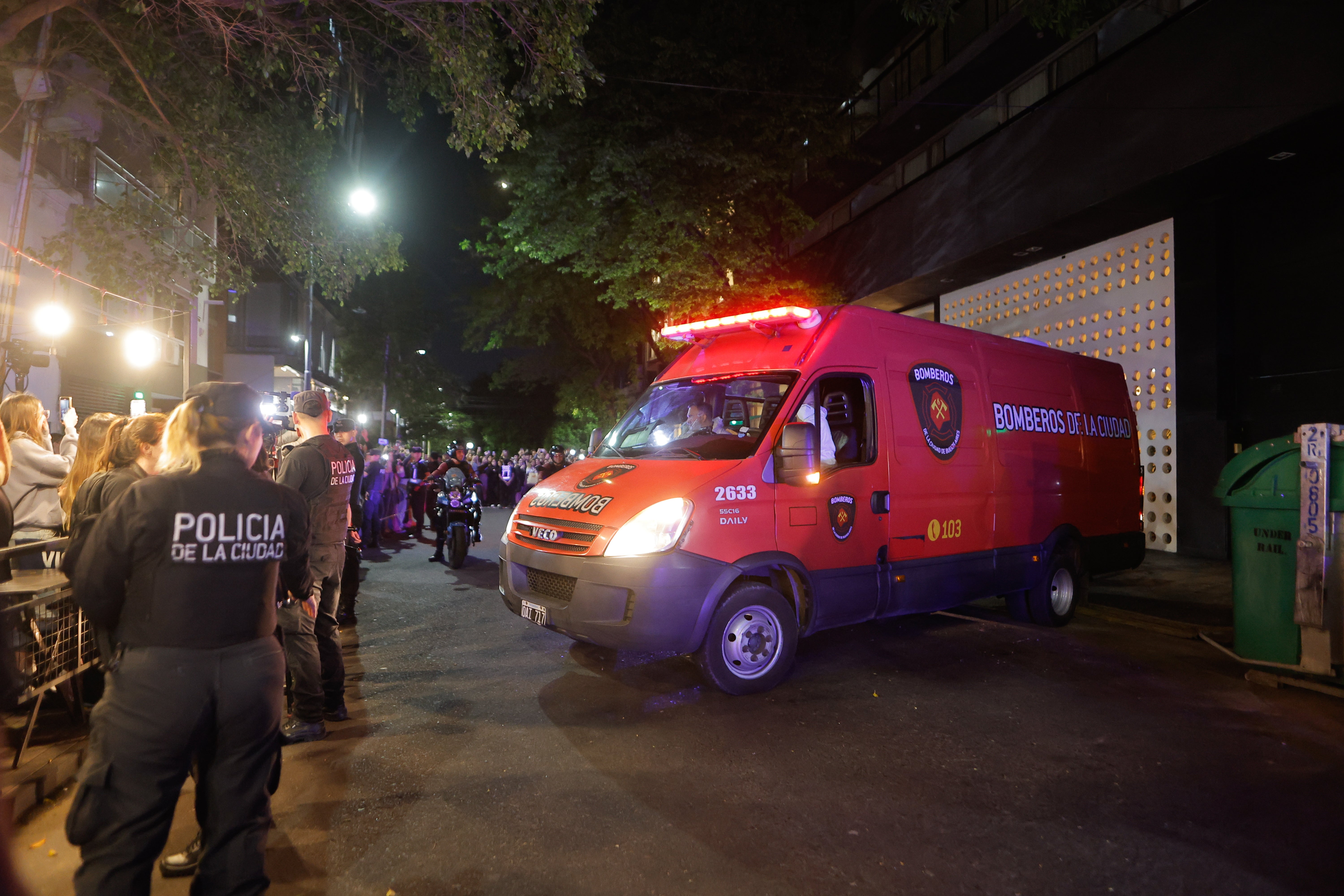 Officials guard the vehicle used to remove Liam Payne’s body from the scene of his death on Wednesday night