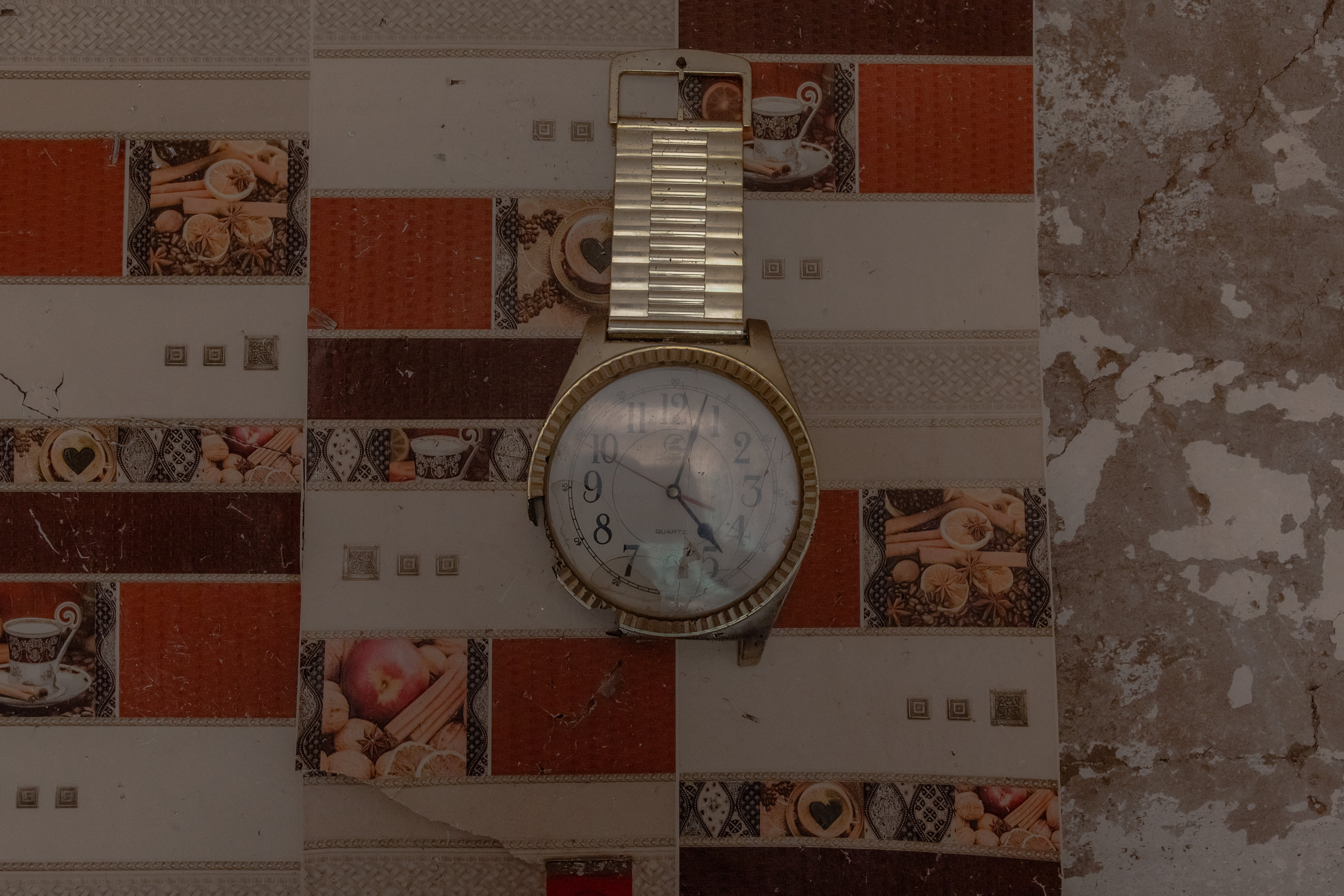 A damaged watch left behind after a recent air attack in a house in a village outside of Kostyantynivka