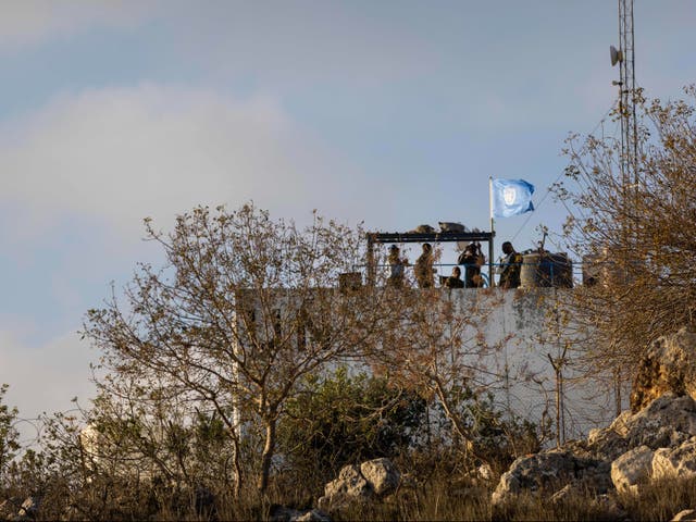 <p>Unifil soldiers scan along the Lebanon-Israel border from their observation spot</p>