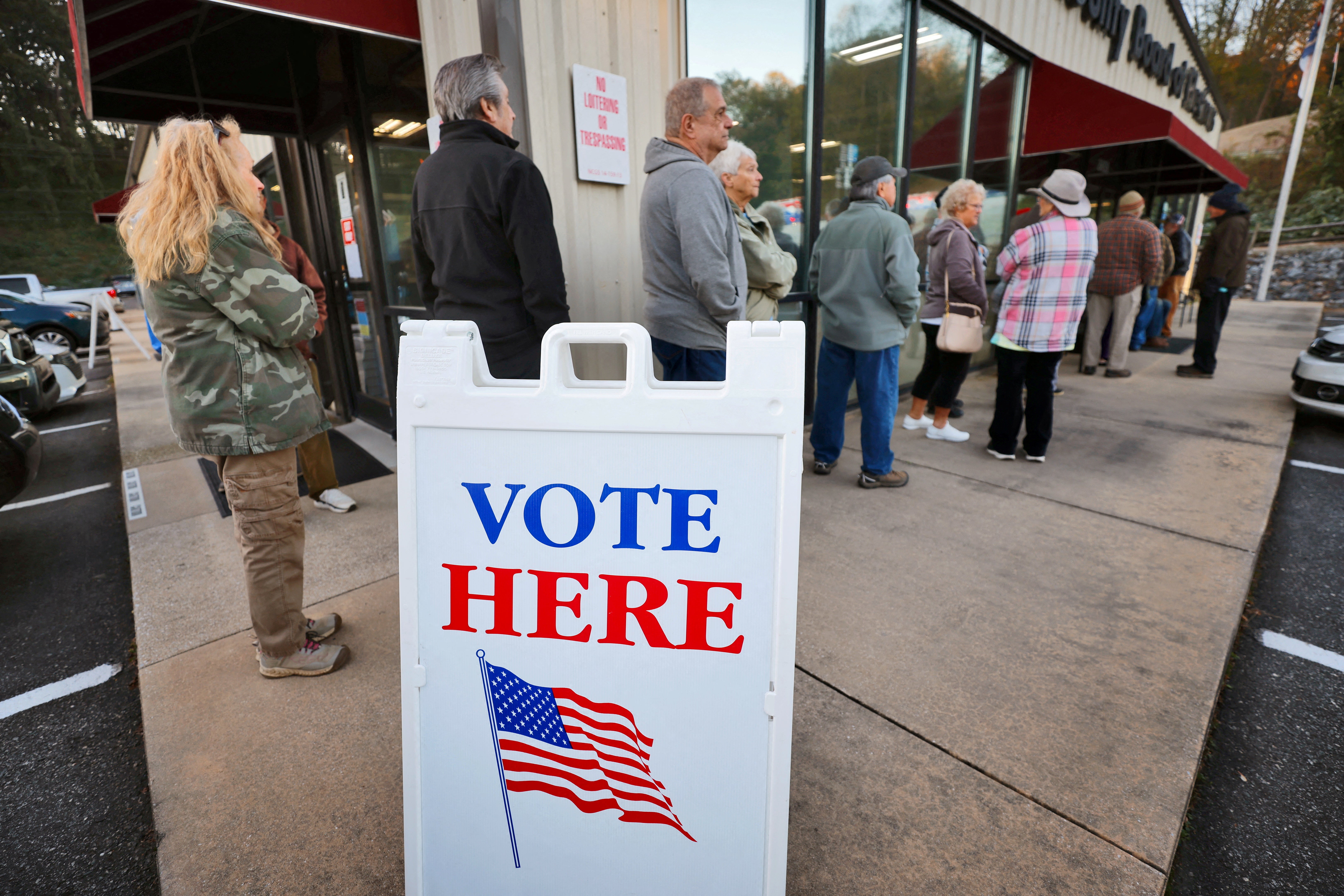 Voters wait in line to cast their ballots on the first day of early in-person voting in one of the mountainous counties badly affected by Hurricane Helene, in Marion, North Carolina