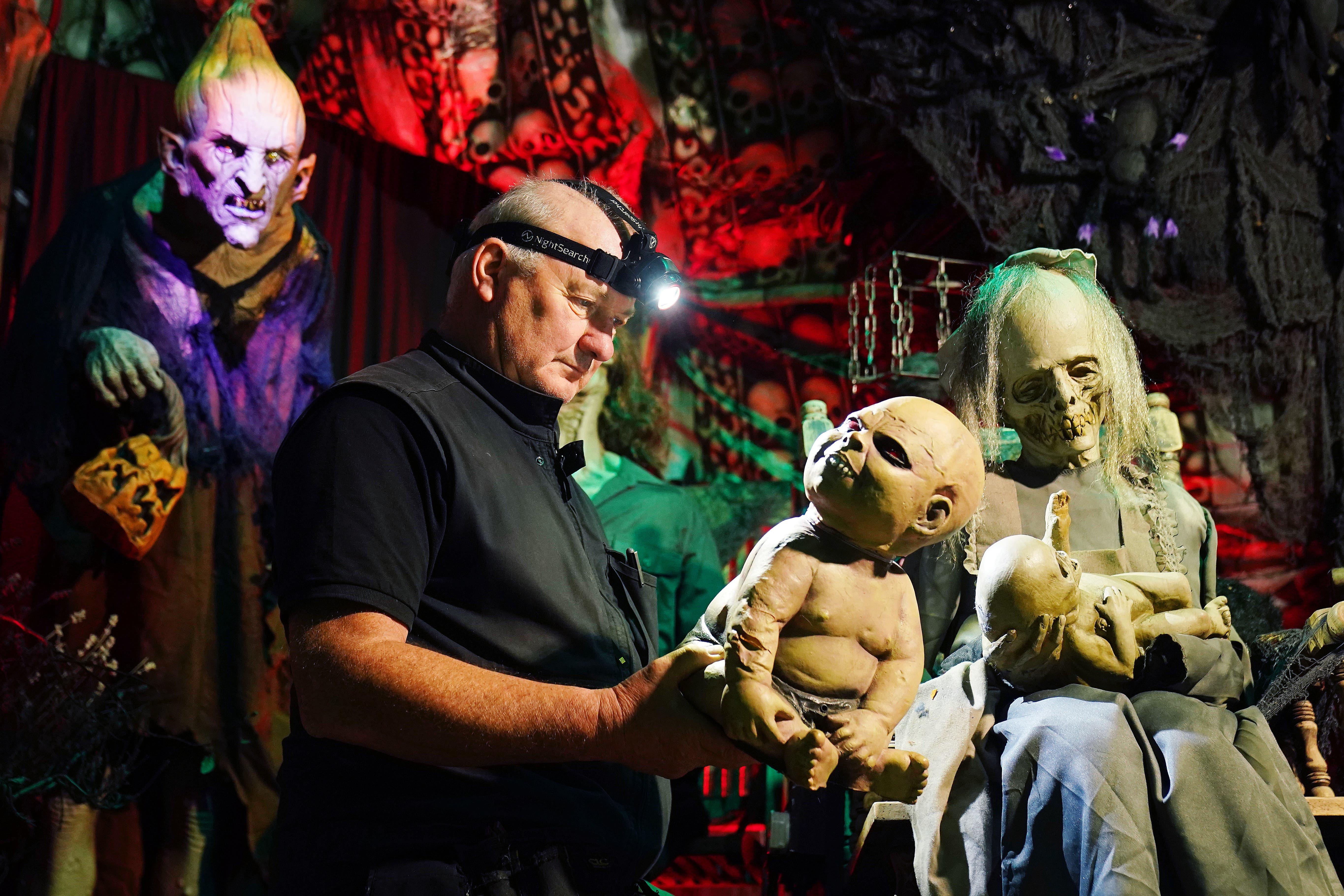 Electrician Ken Carraher continues preparations on his Halloween House of Horrors in Killiney (Brian Lawless/PA)