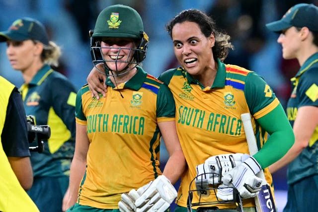 <p>South Africa's Anneke Bosch (L) and Chloe Tryon celebrate their win</p>