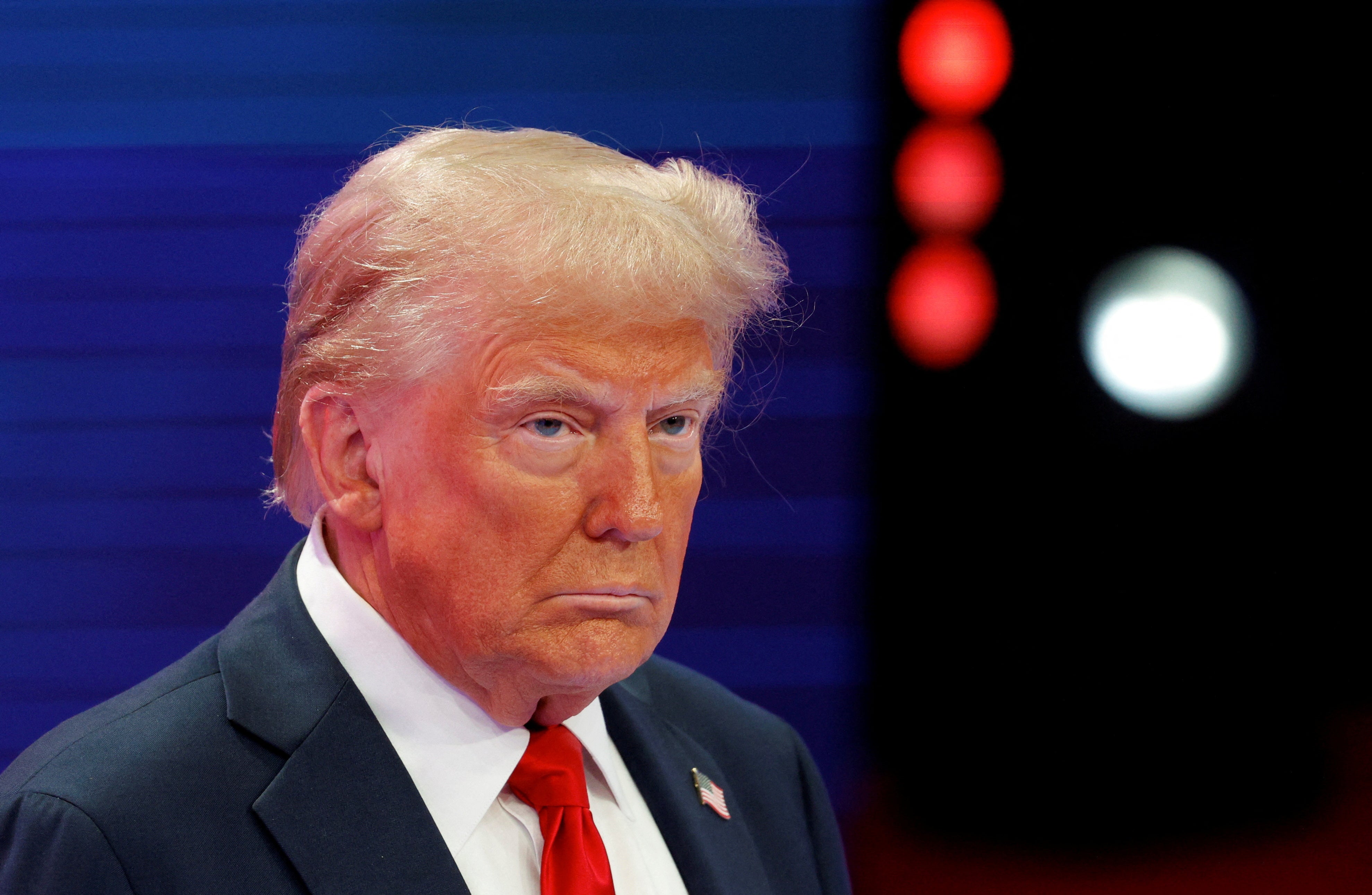 Republican presidential nominee and former US President Donald Trump looks on as he participates in a town hall presented by Spanish-language network Univision, in Doral, Florida on October 16, 2024