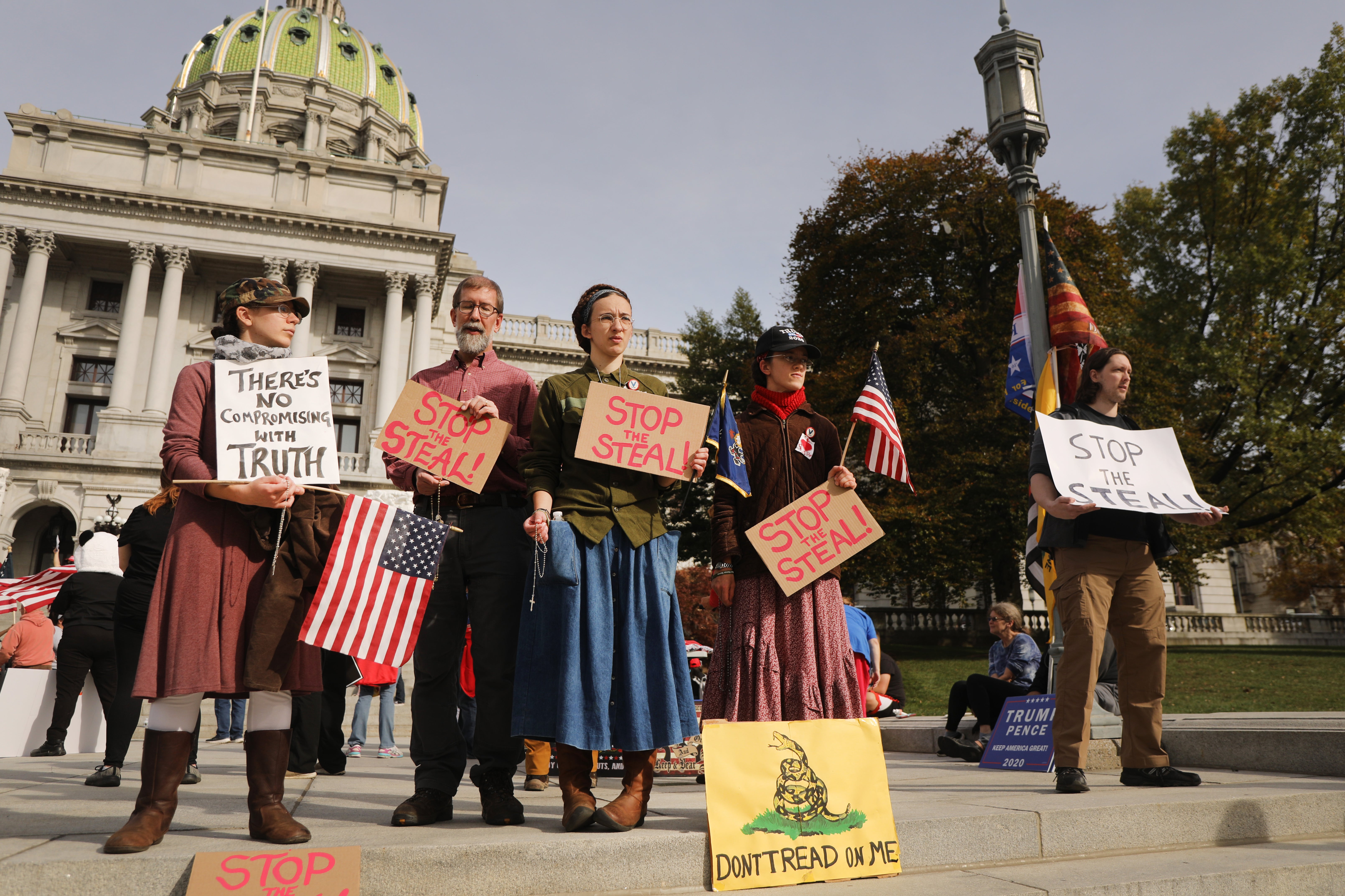 Dozens of people calling for stopping the vote count in Pennsylvania due to alleged fraud against President Donald Trump gather on the steps of the State Capital on November 5, 2020. People who believe the 2020 election was stolen from former president Donald Trump, or were involved in ‘fake elector’ schemes will return as official electors this year