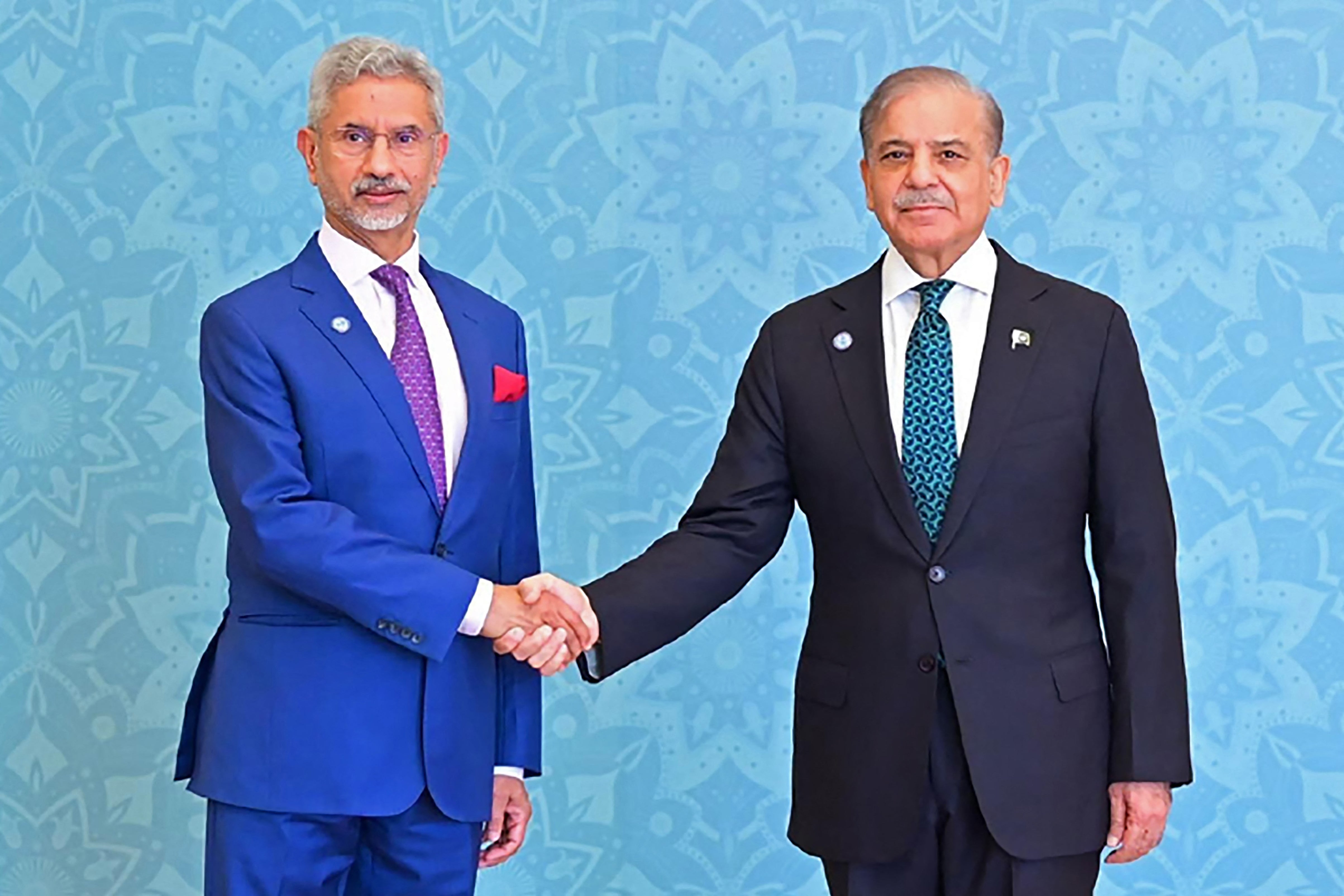 Pakistan’s prime minister Shehbaz Sharif shakes hands with India’s foreign minister S Jaishankar at the Shanghai Cooperation Organisation summit in Islamabad