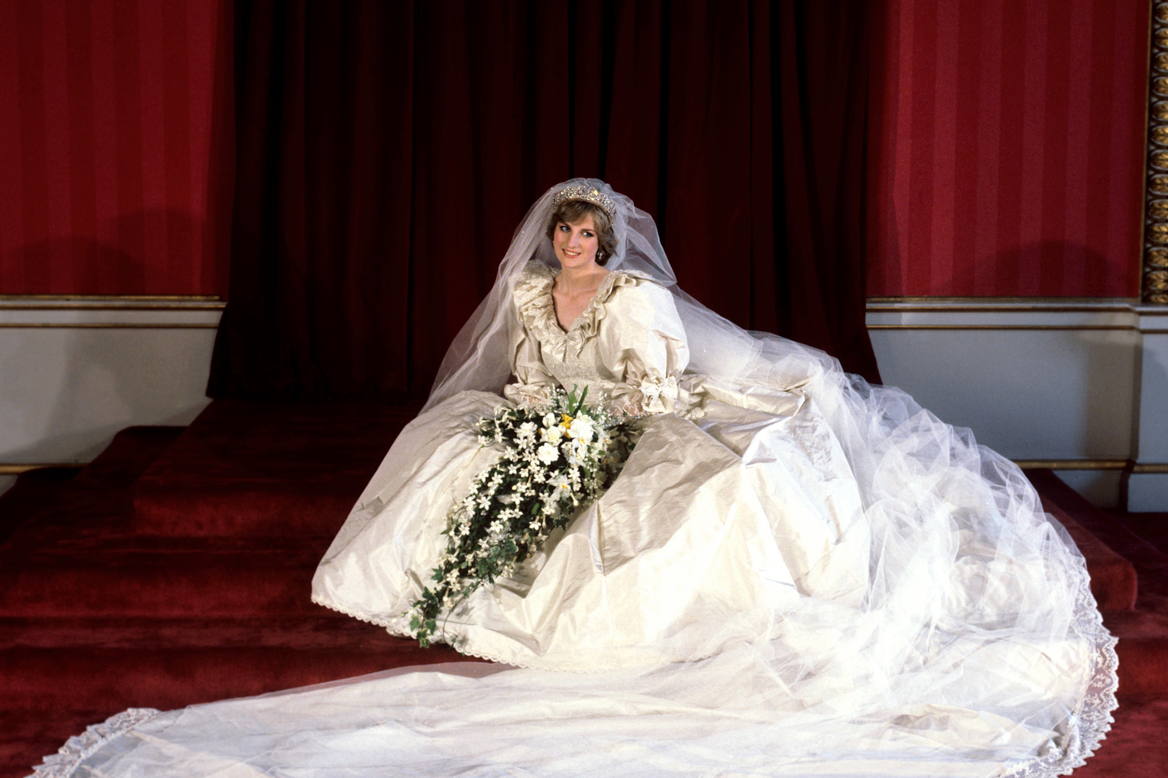 The Princess of Wales seated in her bridal gown at Buckingham Palace (PA)