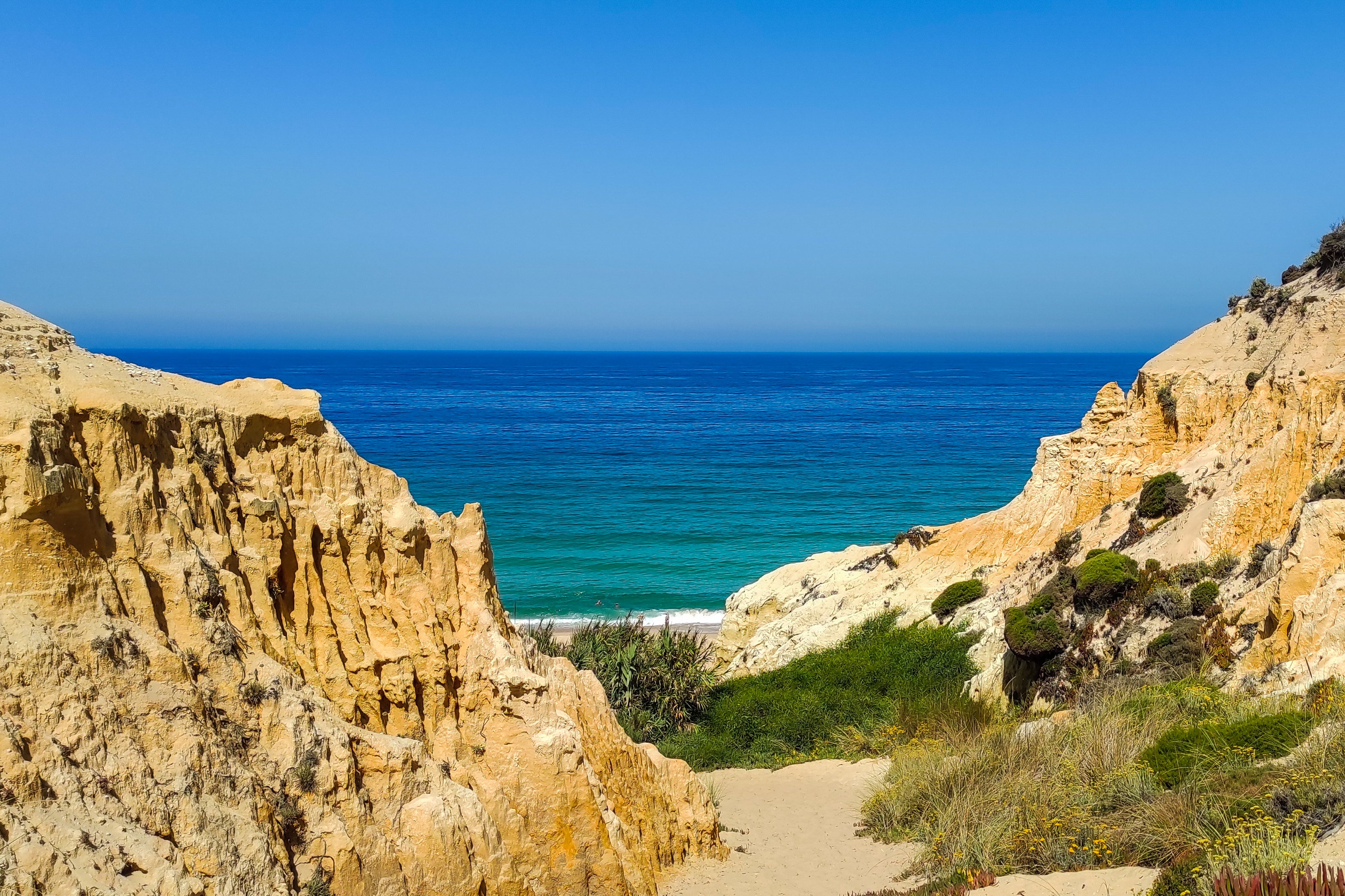 Melides charms with windswept dunes, resident storks, and untouched pine and cork forests