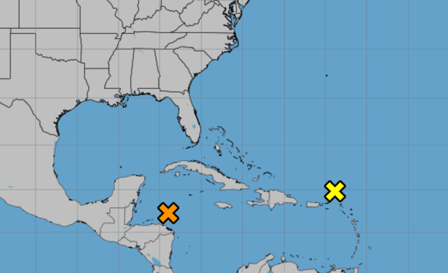 <p>Meteorologists at the National Hurricane Center were watching two areas of disturbance over the Caribbean Sea and the Atlantic Ocean on Friday </p>