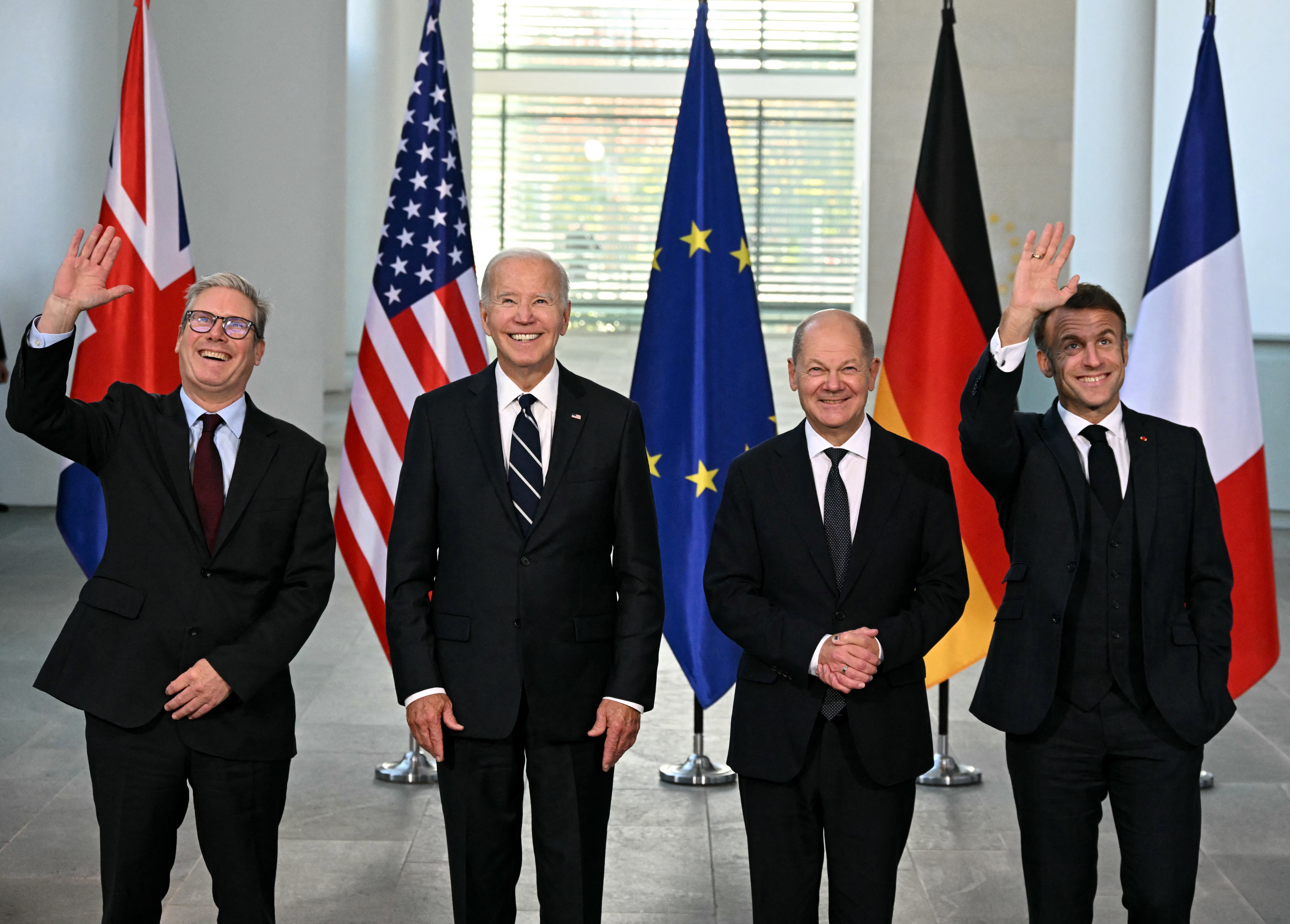 (L-R) British Prime Minister Keir Starmer, US President Joe Biden, German Chancellor Olaf Scholz and French President Emmanuel Macron pose for a photo as they arrive for their Quad meeting at the Chancellery in Berlin