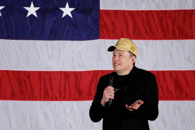 <p>Elon Musk talks to voters in Pennsylvania on October 17. </p>