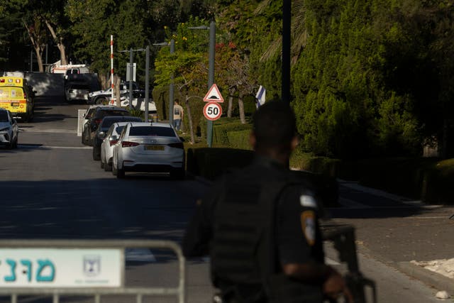 <p>An Israeli emergency worker at the scene after a drone reportedly fired from Lebanon hit a structure in Caesarea, Israel</p>