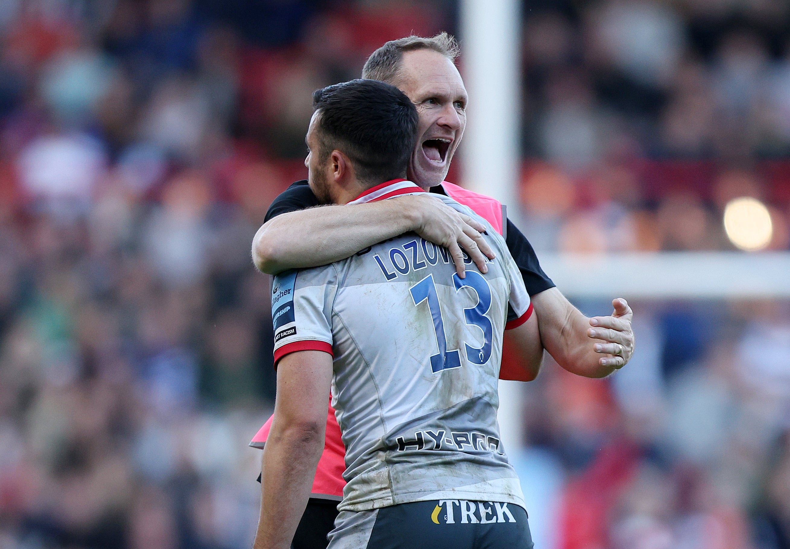 Alex Lozowski celebrates with Dan Vickers, the Saracens kicking coach