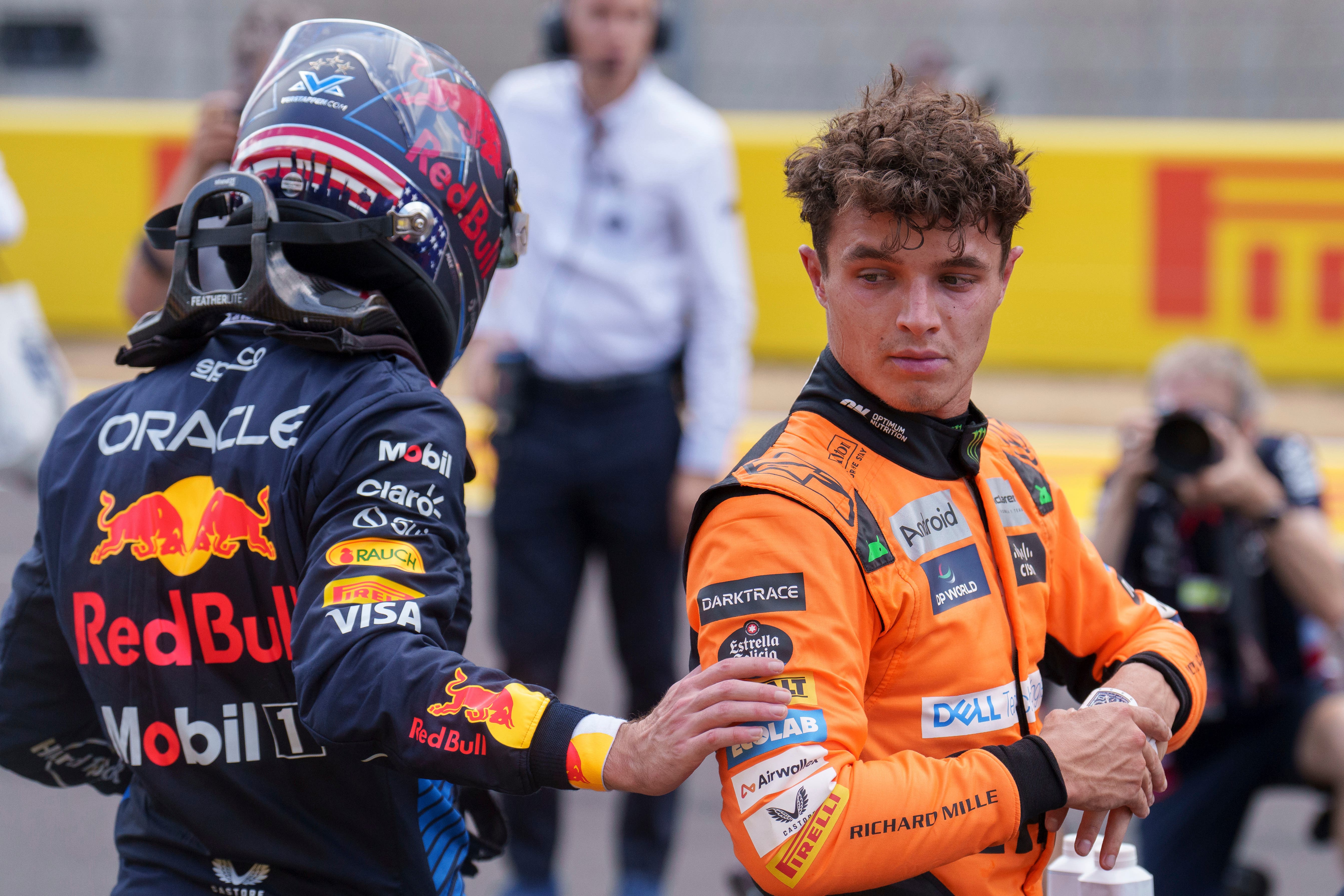 Lando Norris is congratulated by Red Bull driver Max Verstappen (Nick Didlick/AP)