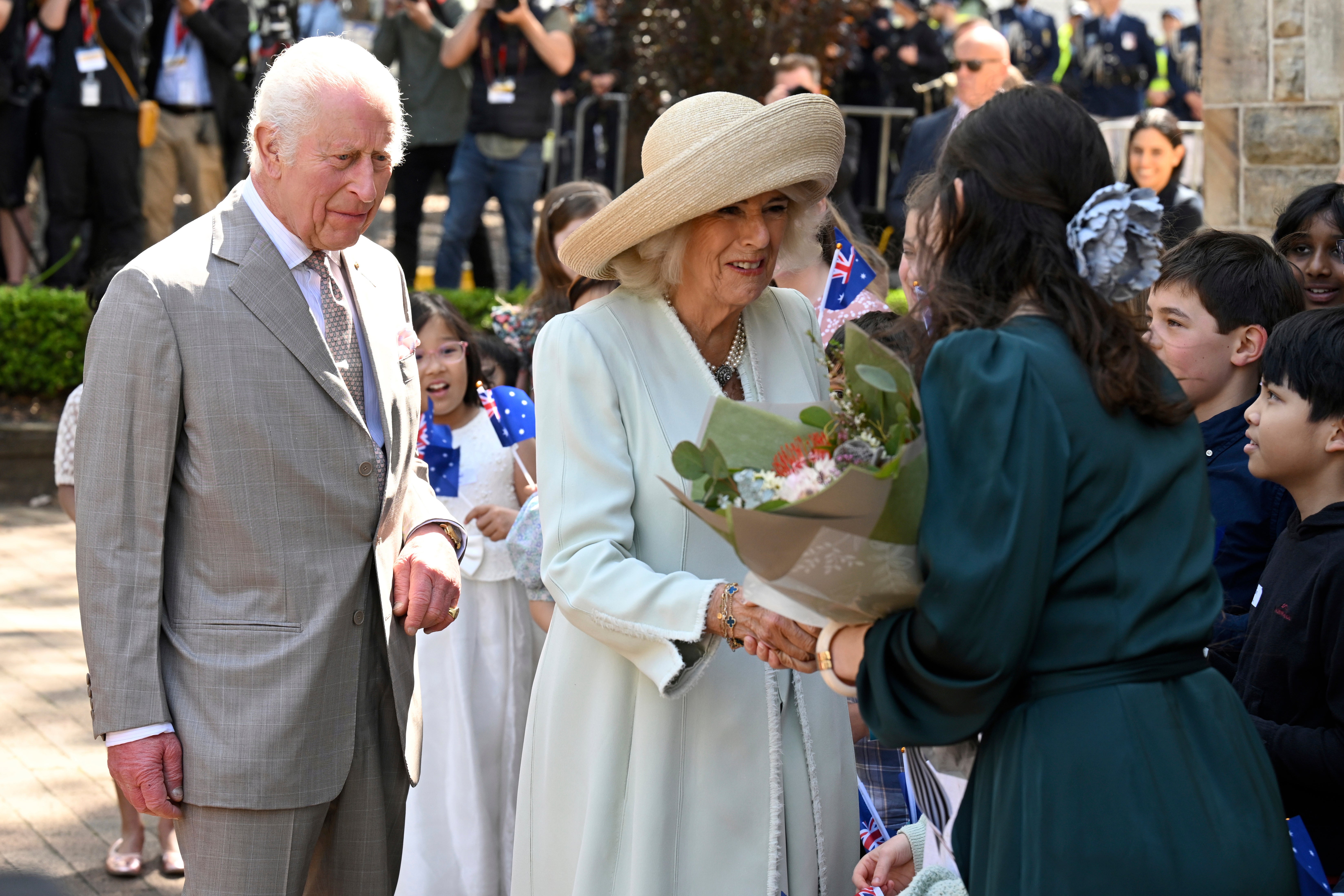 King Charles III, left, and Queen Camilla, center, greet people during a visit to St Thomas' Anglican Church in Sydney, Sunday, 20 Oct 2024