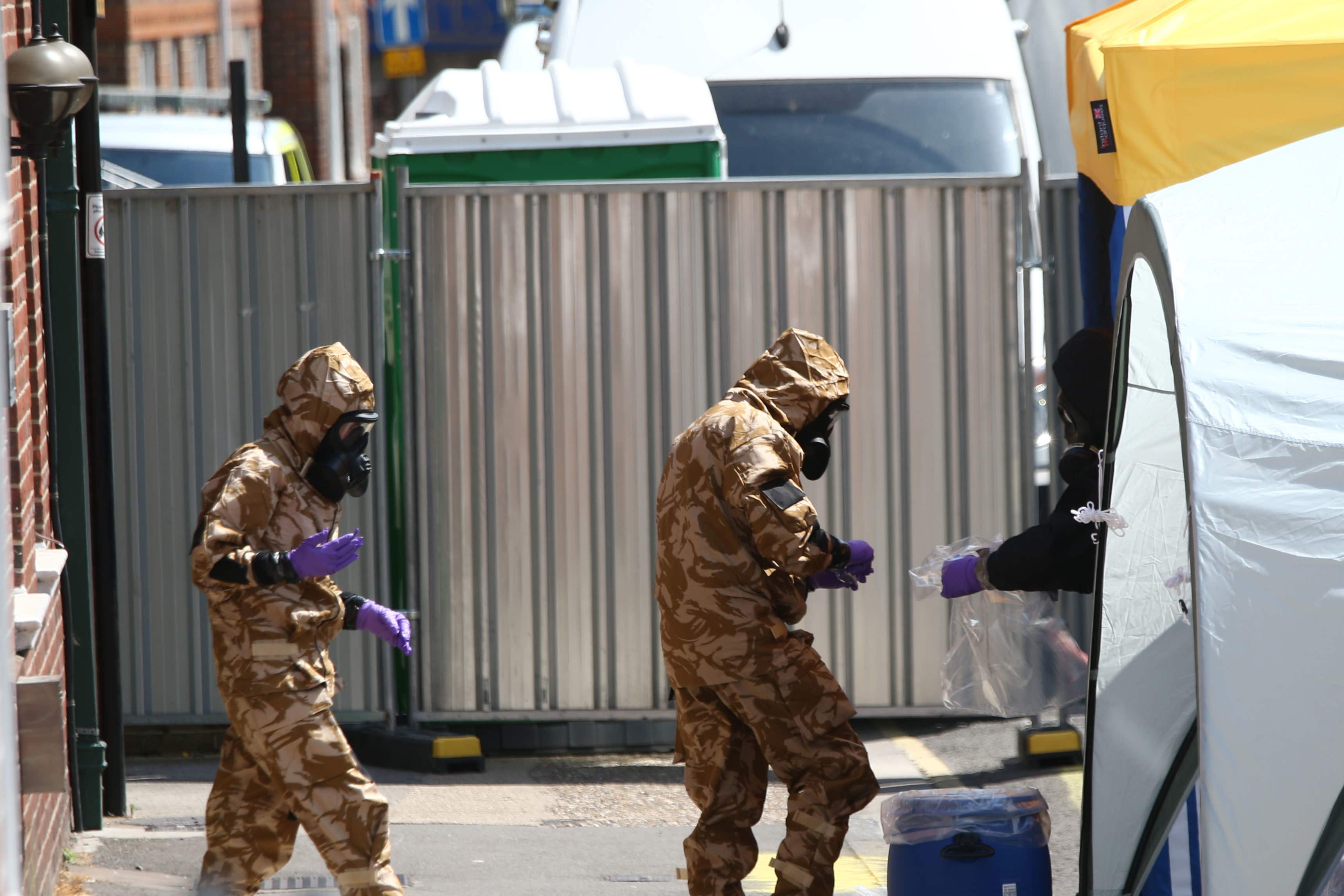 Investigators in chemical suits work in Wiltshire (Yui Mok/PA)