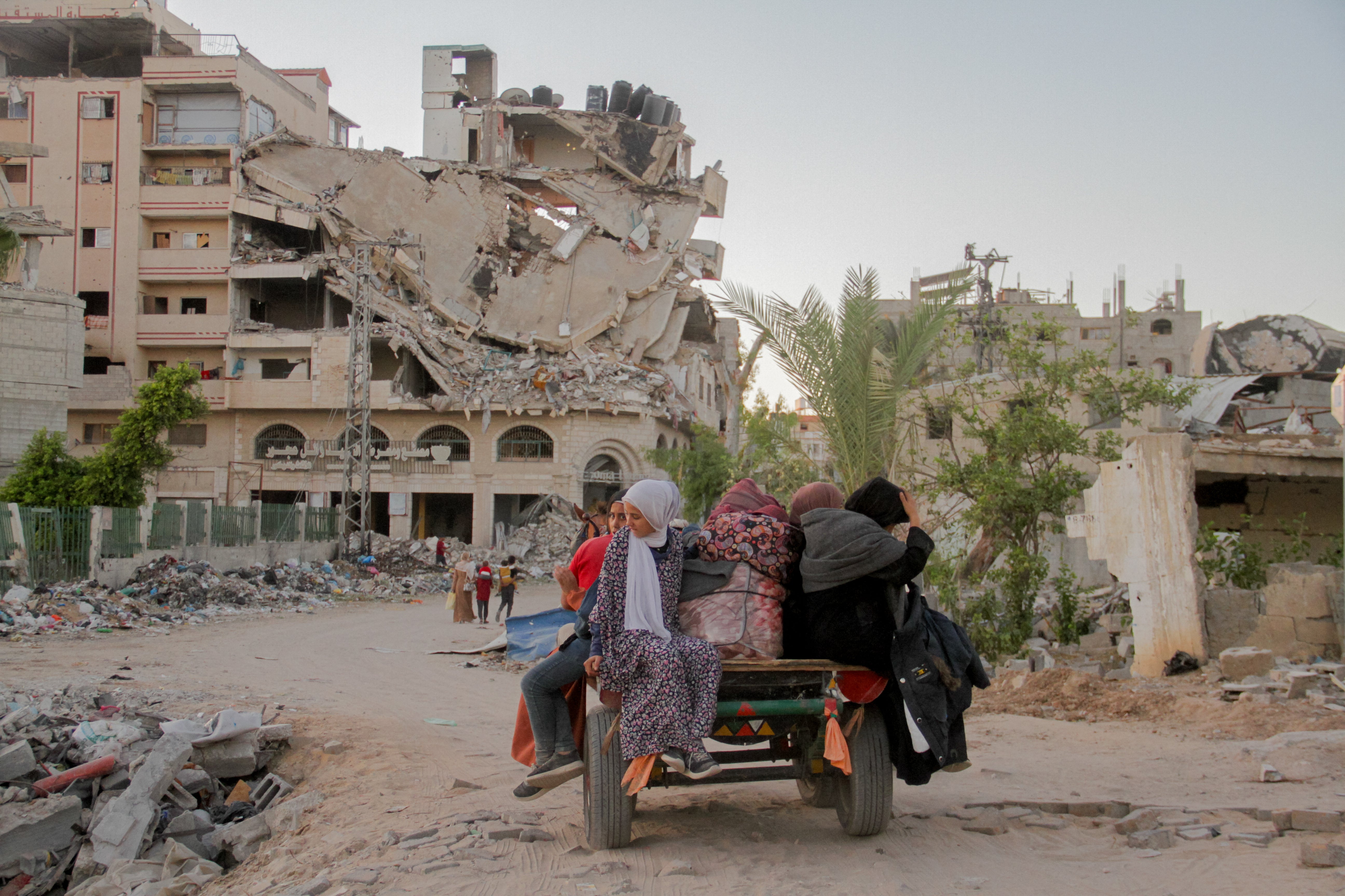 Displaced Palestinians arrive in Gaza City on Saturday