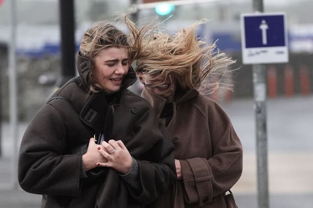 People struggle to walk in the wind on the promenade in Salthill, Galway, as a Met Eireann orange alert for Kerry, Leitrim, Sligo, Clare, Donegal, Mayo and Galway came into effect at 10am on Sunday and will be in place to 8pm as Storm Ashley sweeps across the island of Ireland. The forecaster said the first named storm of the season is to bring very strong and gusty south to south-west winds, coupled with high spring tides. The counties covered could see gusts of up to 130kph. Picture date: Sunday October 20, 2024.