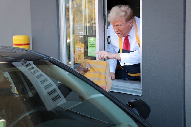 <p>Donald Trump works the drive-thru at a McDonald’s during a campaign stop in Pennsylvania</p>