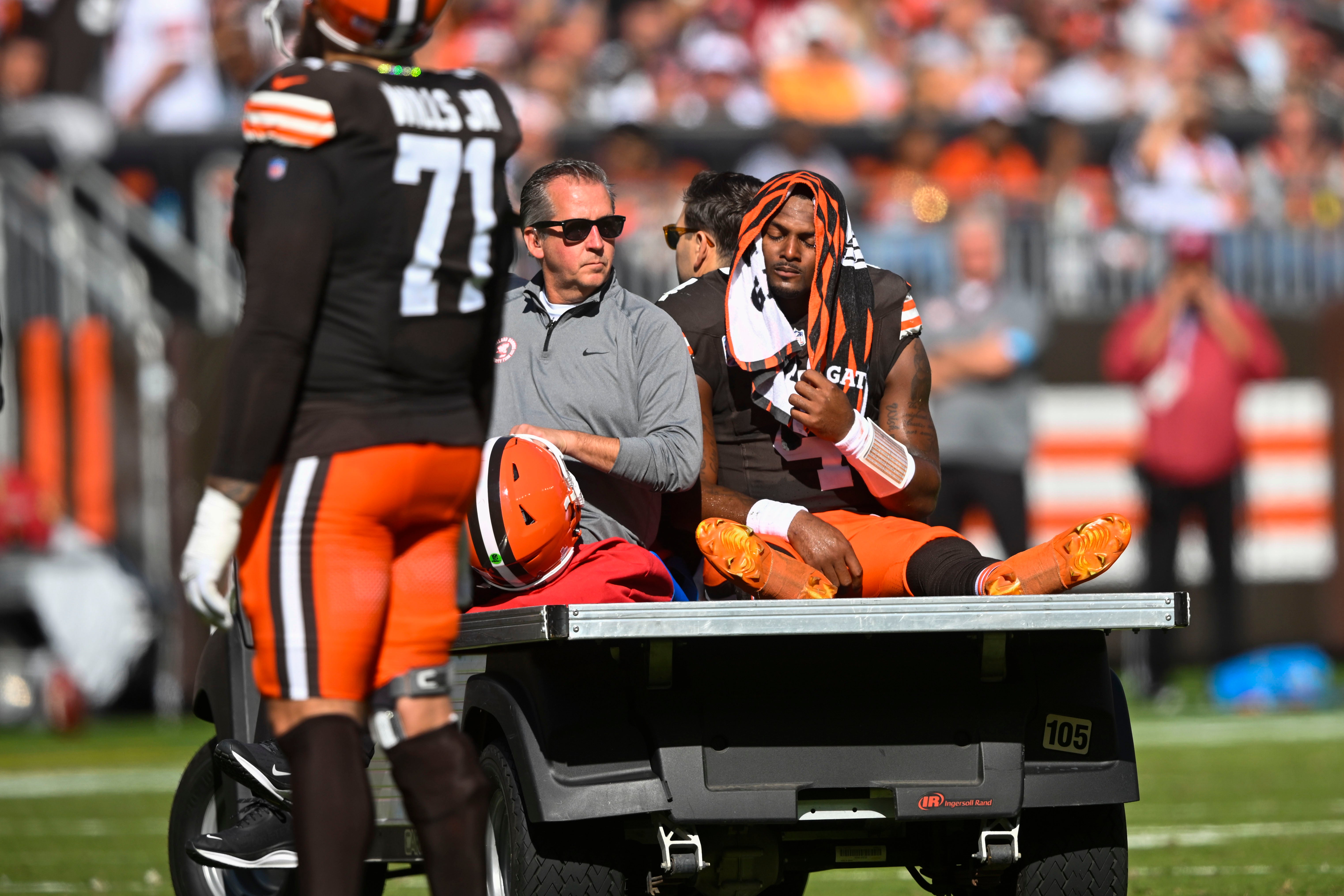 Cleveland Browns quarterback Deshaun Watson (4) is carted off the field after being injured against the Cincinnati Bengals (David Richard/AP)