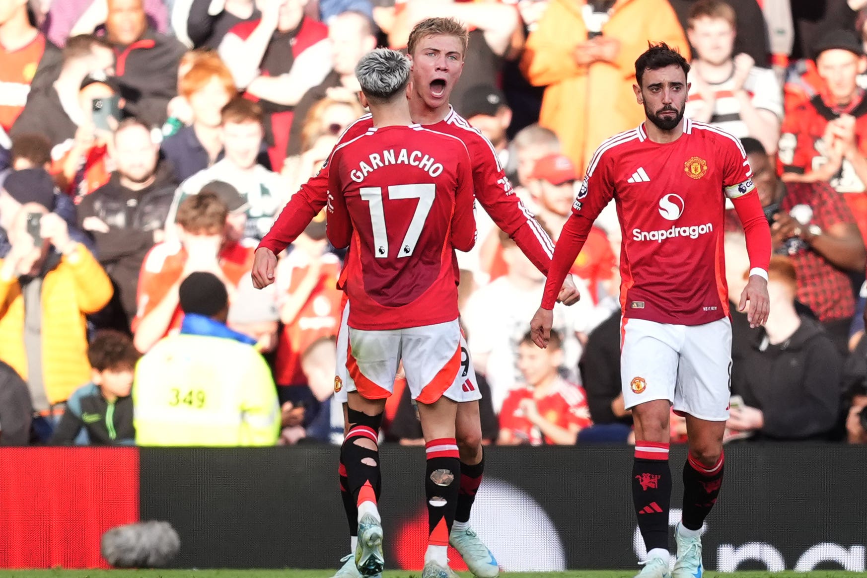 Rasmus Hojlund (centre) celebrates with Alejandro Garnacho after scoring their side’s second goal of the game during the Premier League match at Old Trafford, Manchester. Picture date: Saturday October 19, 2024.