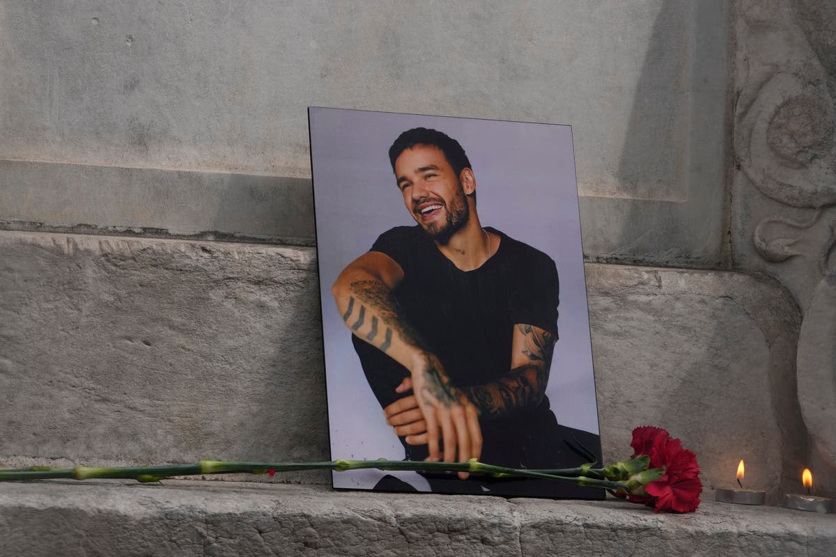 Liam Payne death latest: Hundreds of One Direction fans mourn singer at London vigil