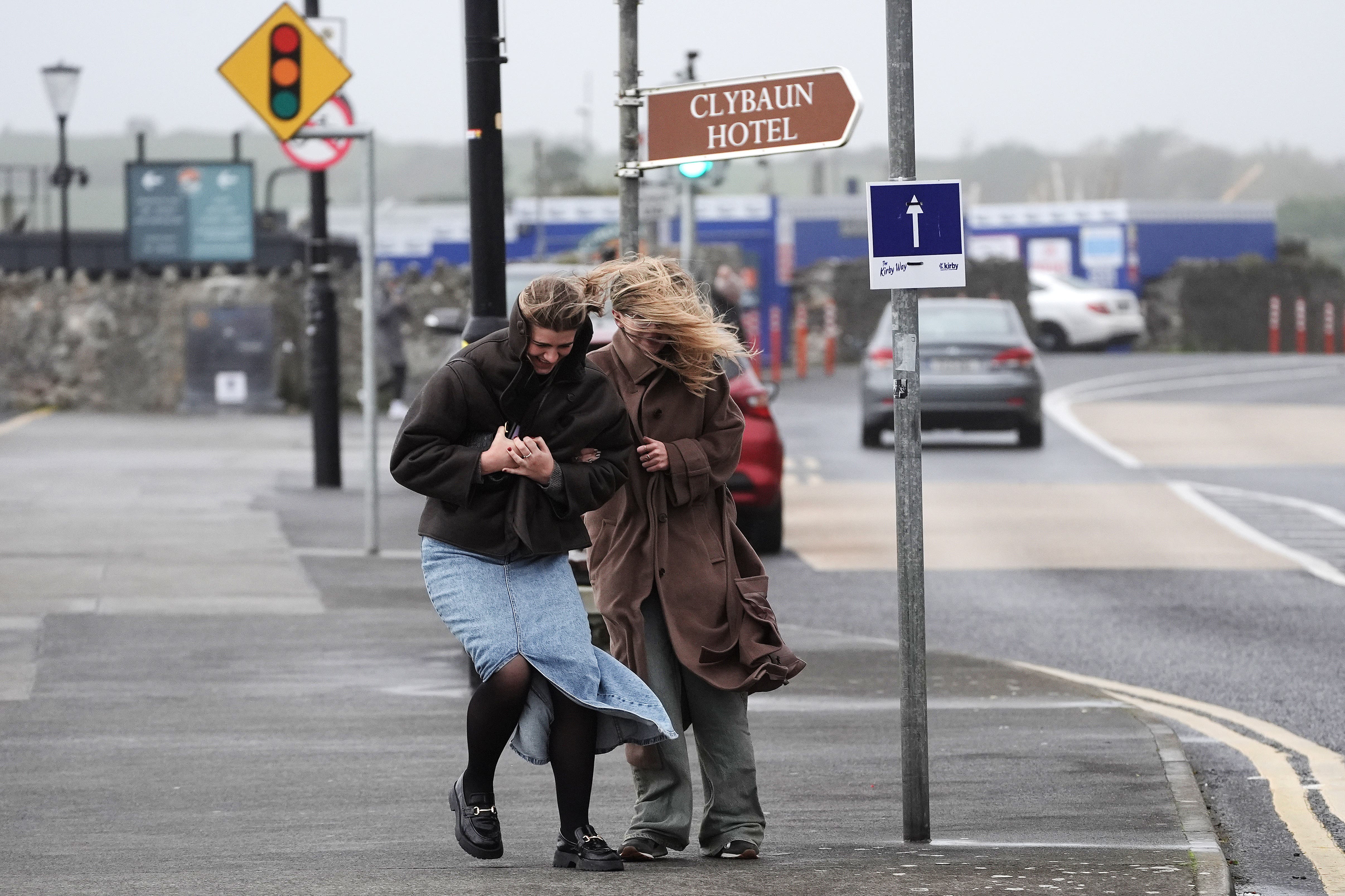 People struggle to walk in the wind on the promenade in Salthill, Galway