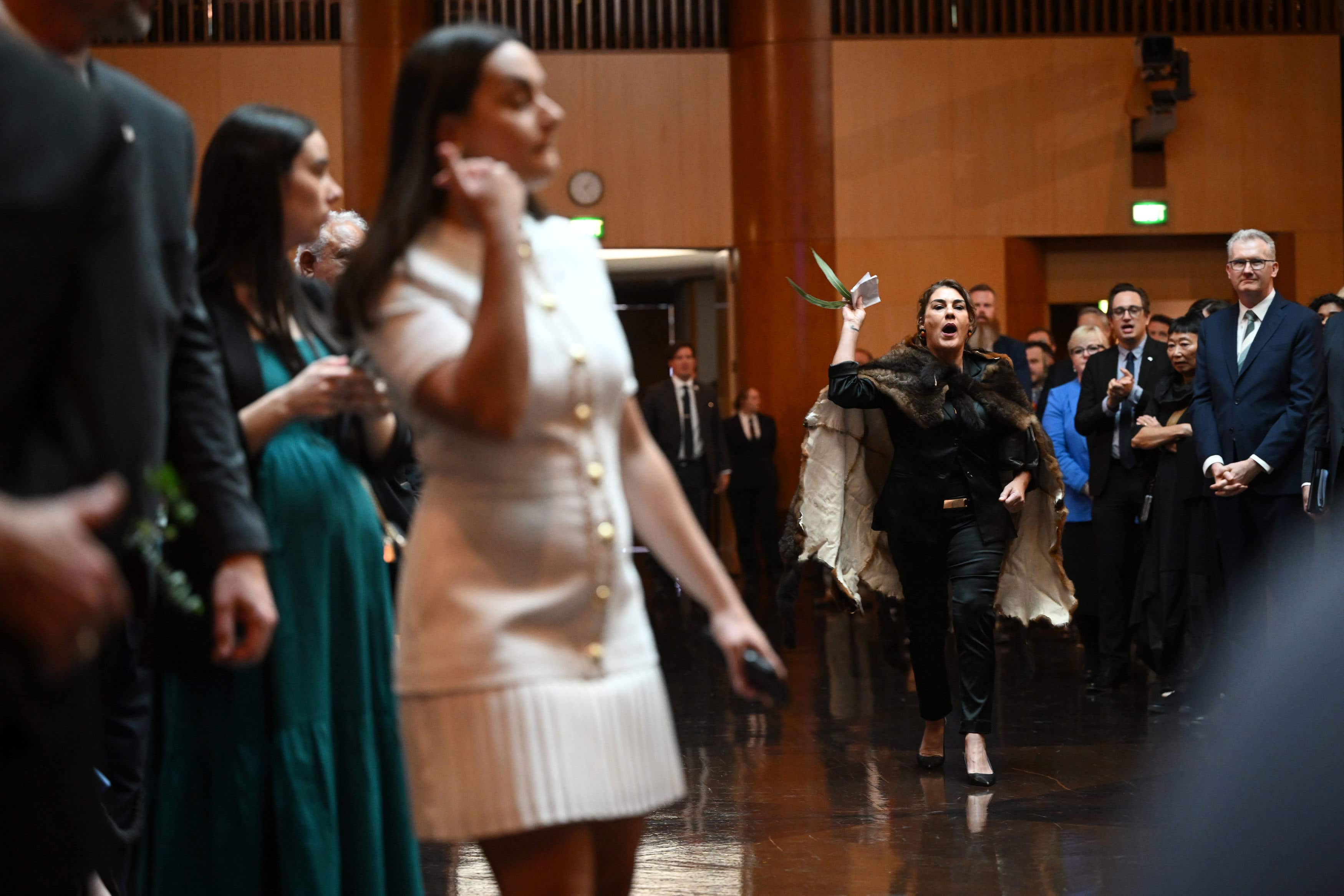 A protester interrupts during the Ceremonial Welcome to Australia for the King and Queen at Australian Parliament House in Canberra (Victoria Jones/PA)