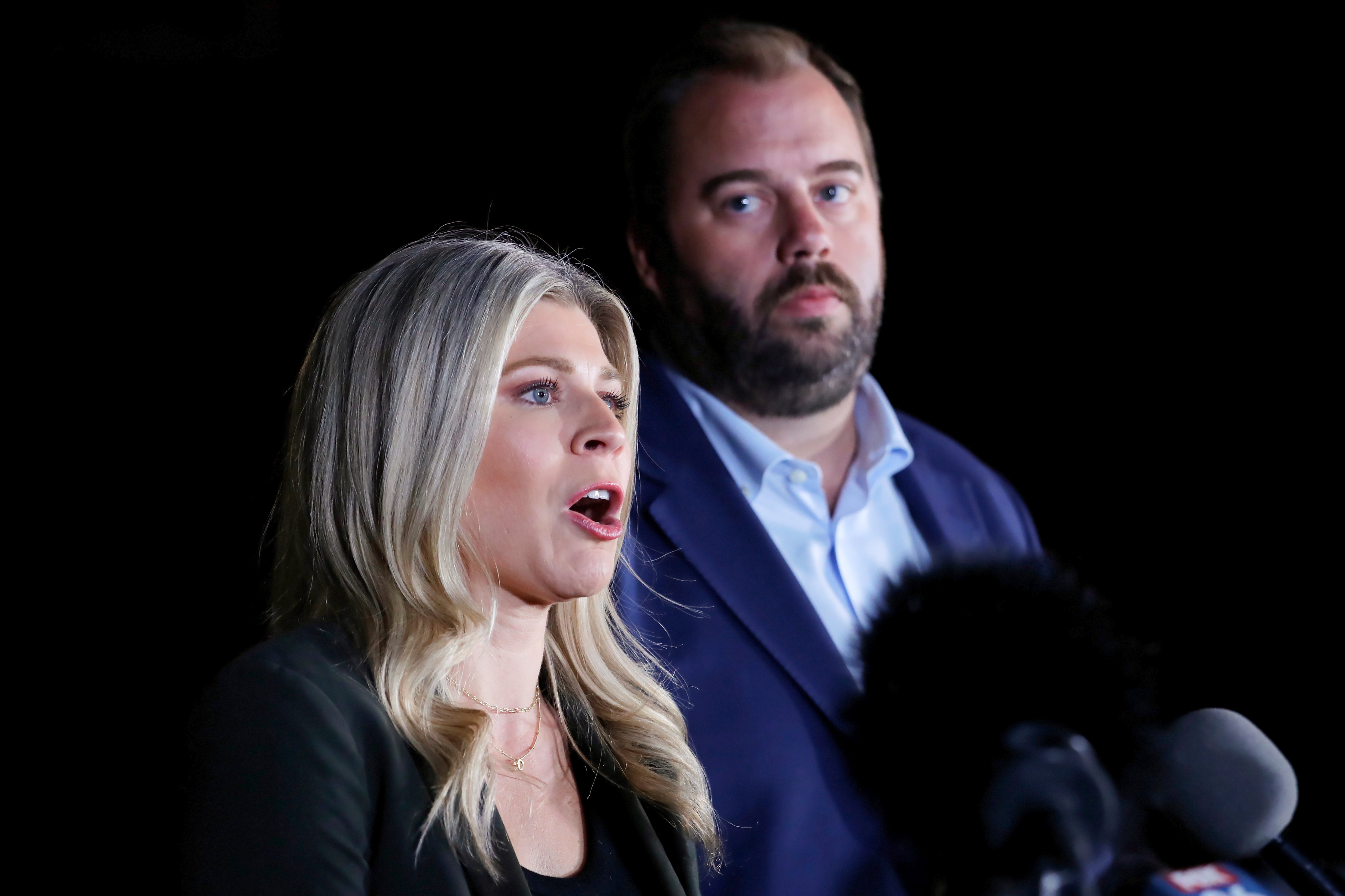 Texas state representatives Lacey Hull, left, and John Bucy III, right, comment during a press conference after the stay granted by the Texas Supreme Court