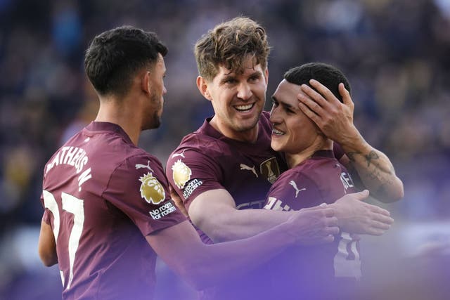 John Stones, centre, helped Manchester City to a 31st Premier League game unbeaten (Nick Potts/PA)