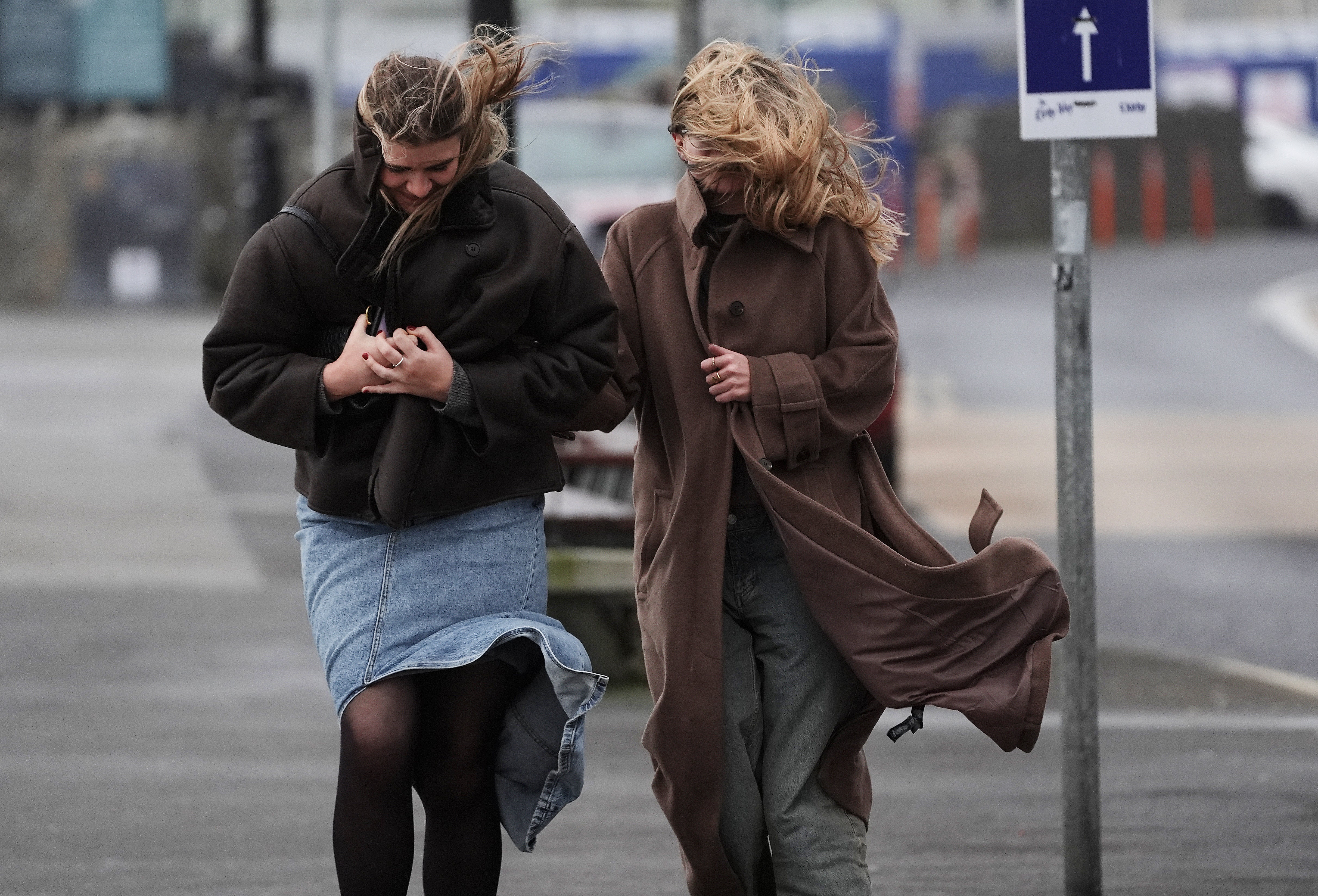 People struggle to walk in the wind on the promenade in Salthill, Galway