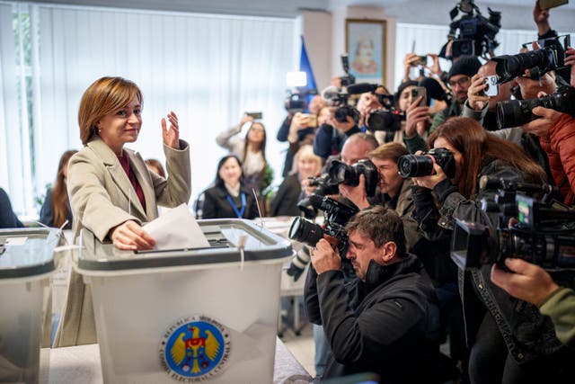 <p>Moldova’s president Maia Sandu prepares to cast her vote in the capital Chisinau on Sunday </p>