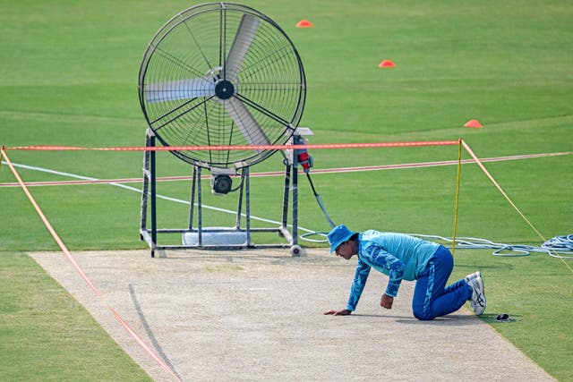 <p>Pakistan’s Noman Ali inspects the pitch during a practice session on Monday</p>