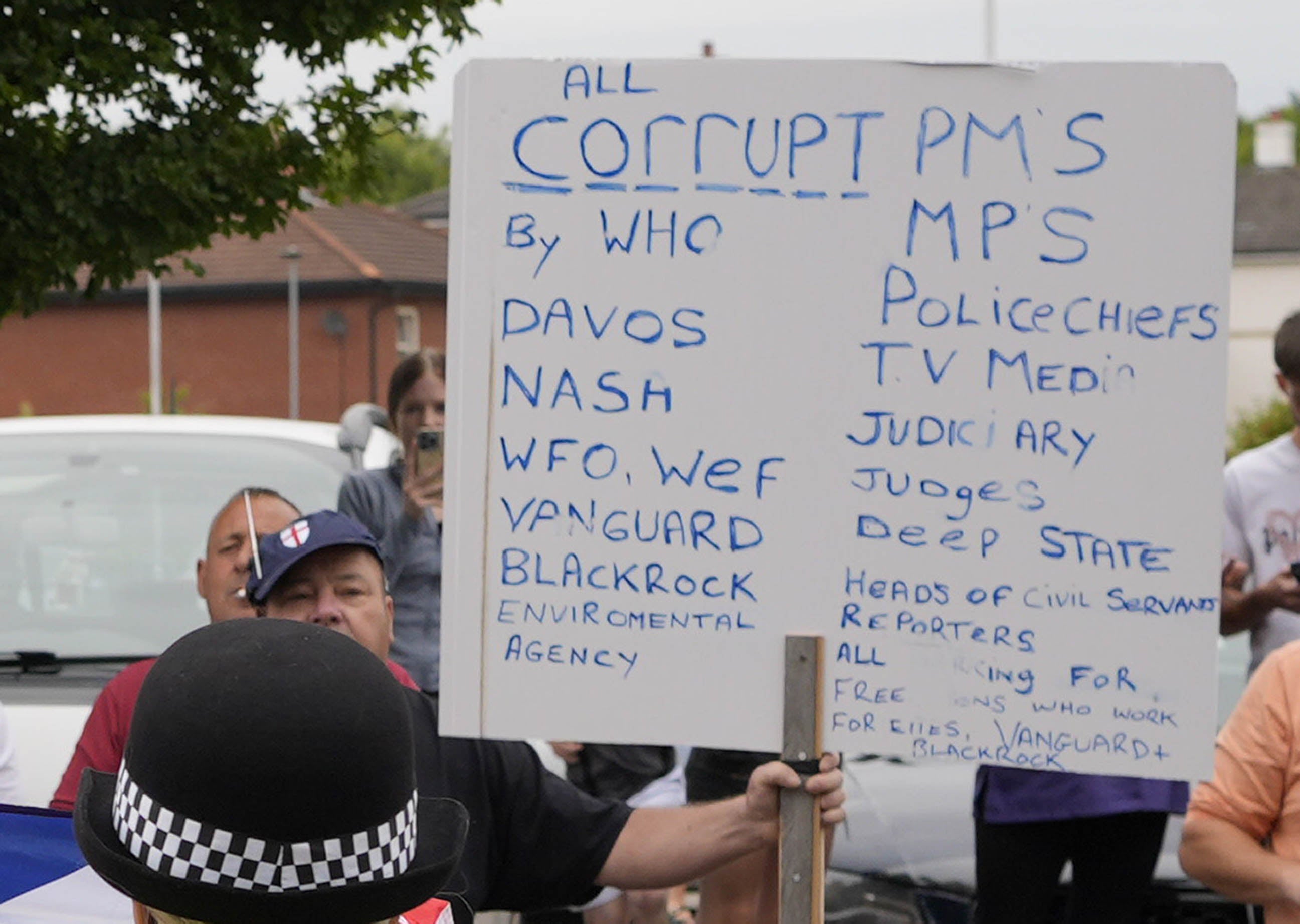 Lynch pictured holding a placard outside the Holiday Inn in Rotherham