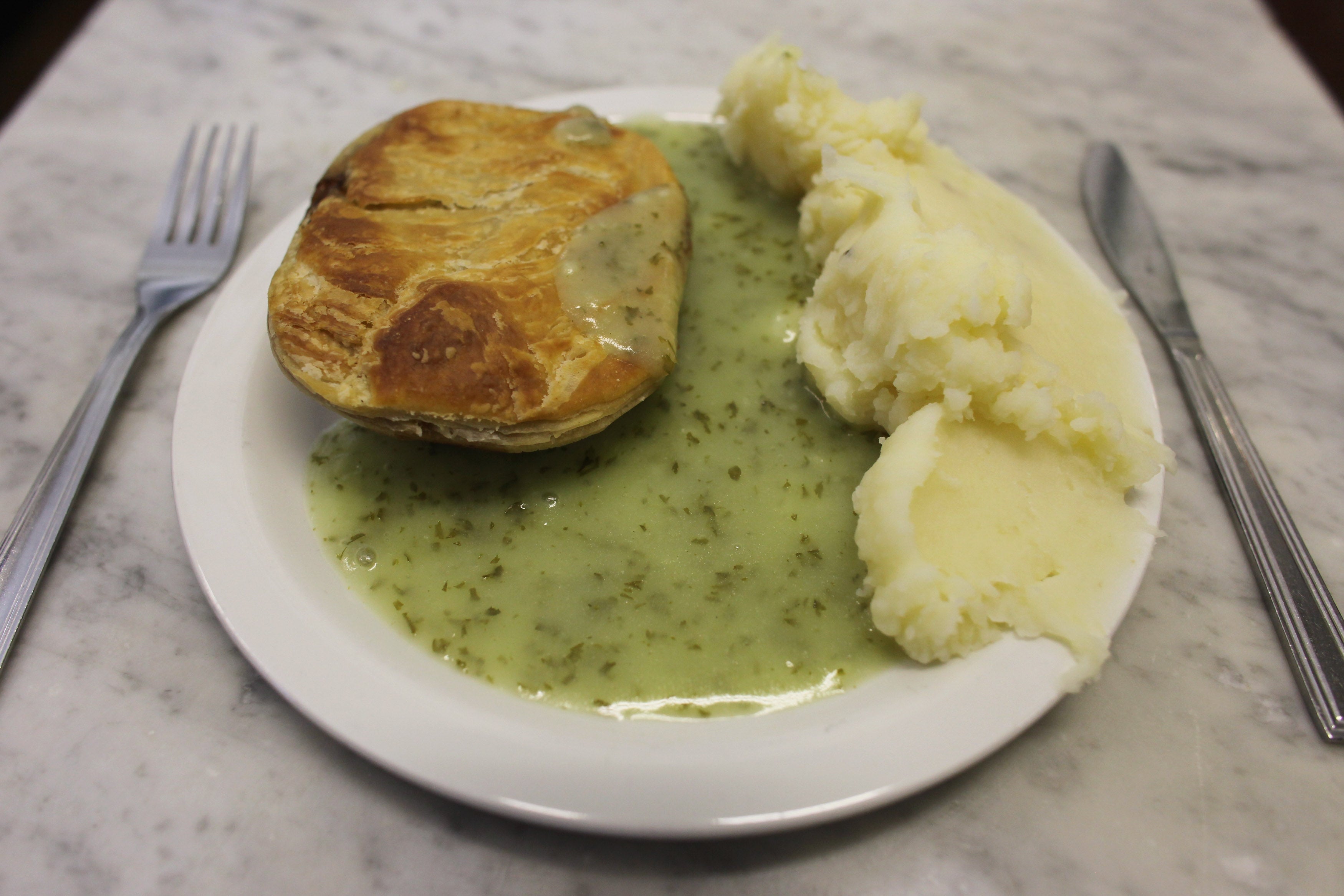 The recipe involves a minced beef pie served with mashed potatoes and a parsley sauce known as liquor